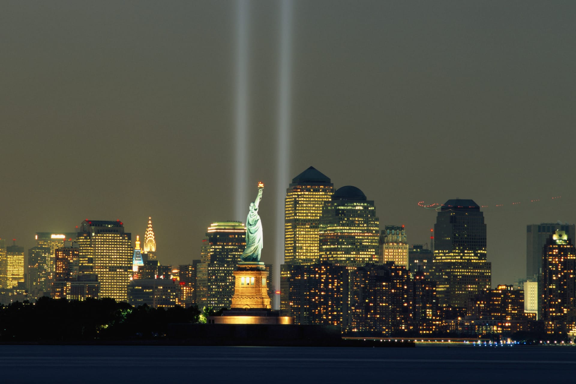 <p>9/11 memorial lights over New York City skyline.</p>