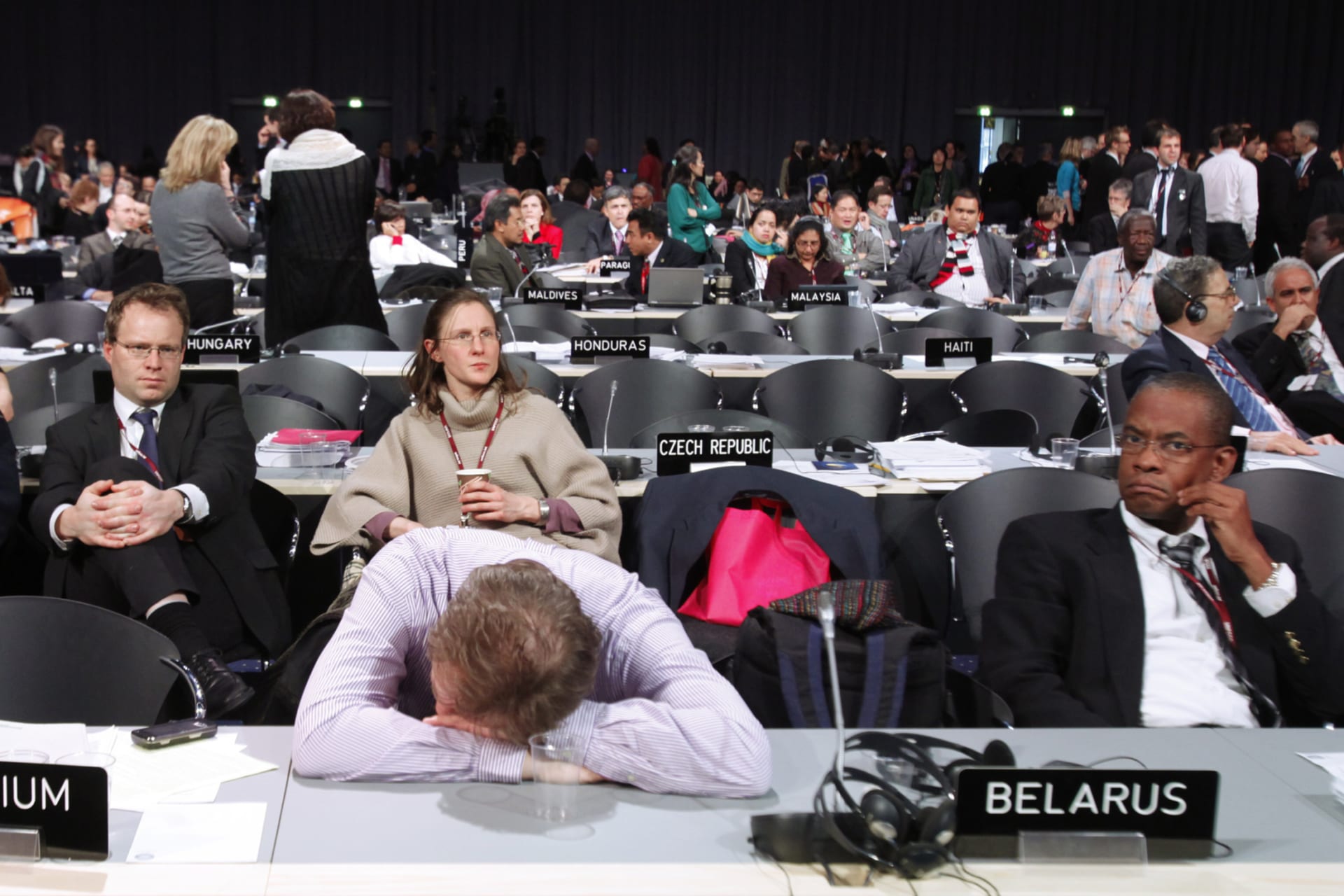 <p>A delegate sleeps during a break in an all-night plenary meeting at the UN Climate Change Conference 2009 in Copenhagen on December 19, 2009.</p>