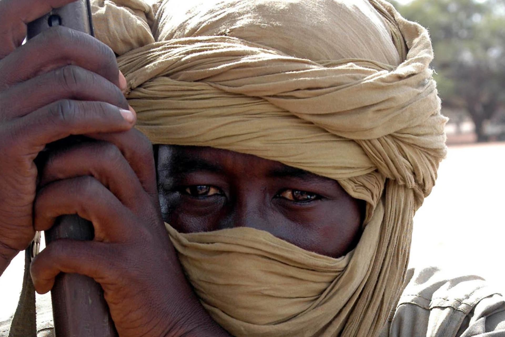 <p>A rebel with the National Redemption Front, an alliance formed by the groups who have not signed the Darfur Peace Agreement, holds his weapon in an outpost in Umm Sidir, north Darfur, on August 28, 2006.</p>
