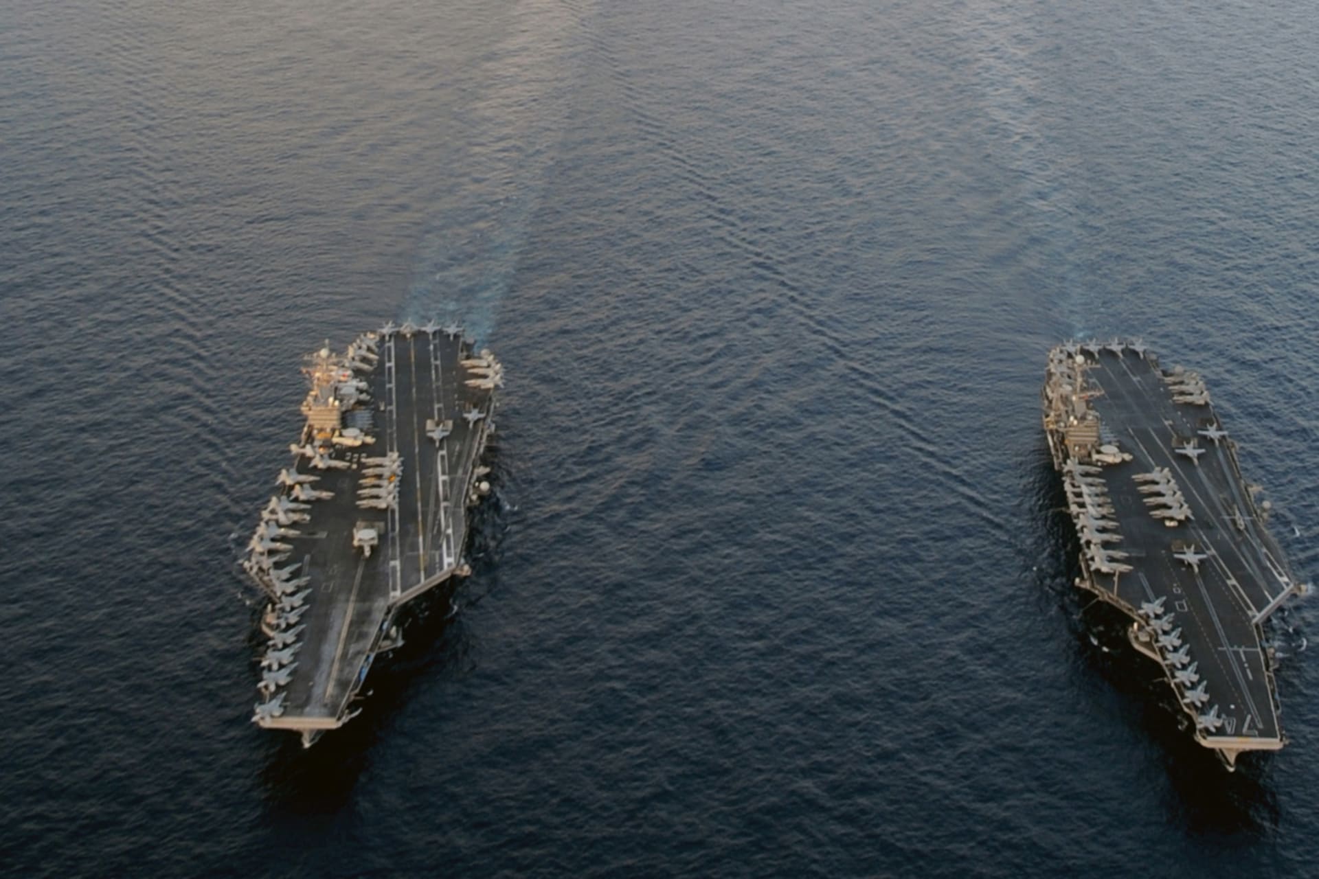 <p>The Nimitz-class aircraft carriers USS Abraham Lincoln (CVN 72) and USS John C. Stennis (CVN 74) join for a turnover of responsibility in the Arabian Sea in this U.S. Navy handout photo dated January 19, 2012.</p>