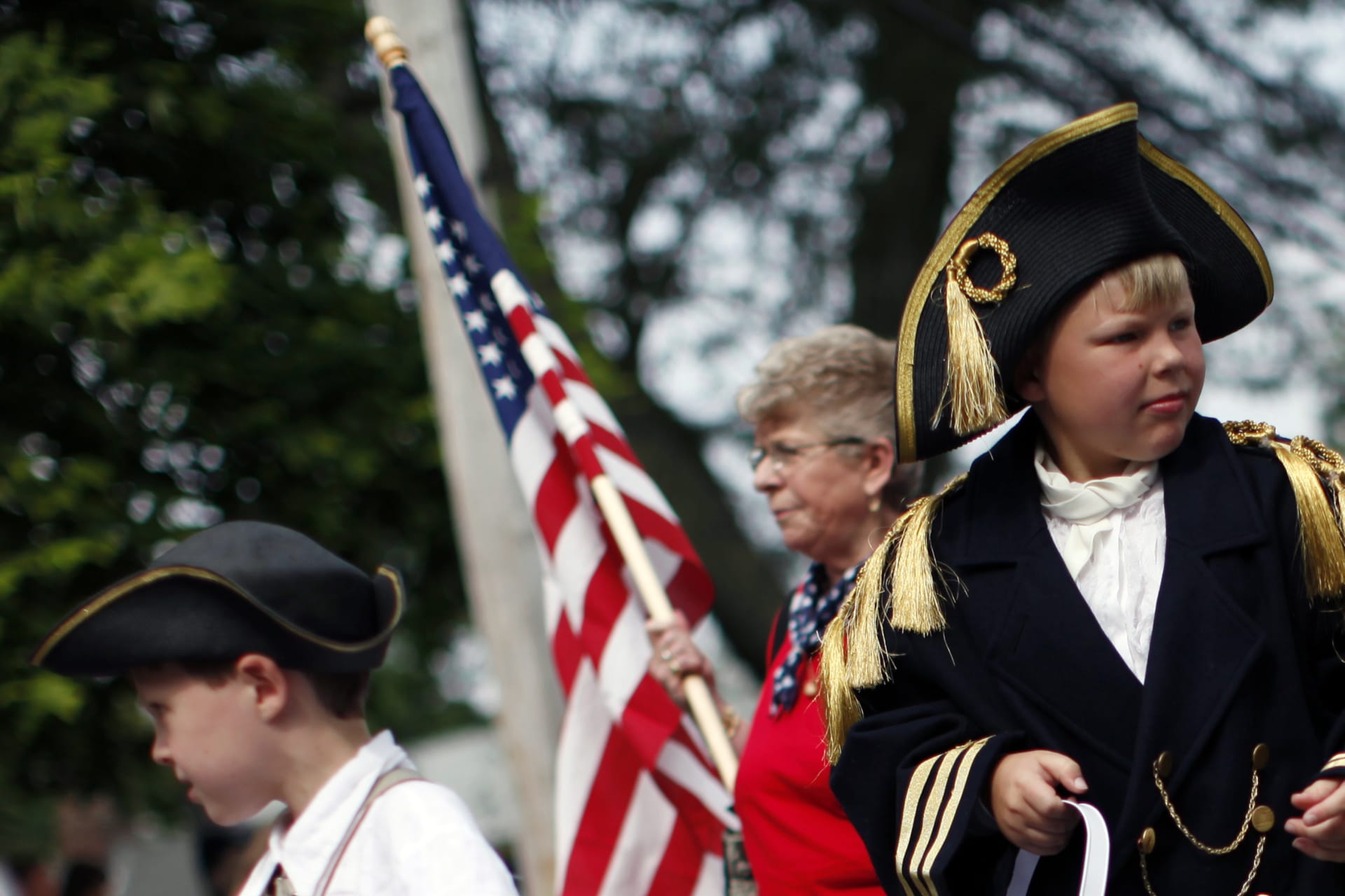 <p>Children and adults march in the Barnstable Fourth of July parade, in Barnstable Village, one of America’s oldest settled towns founded in 1639 on Cape Cod, Massachusetts, on July 4, 2011.</p>