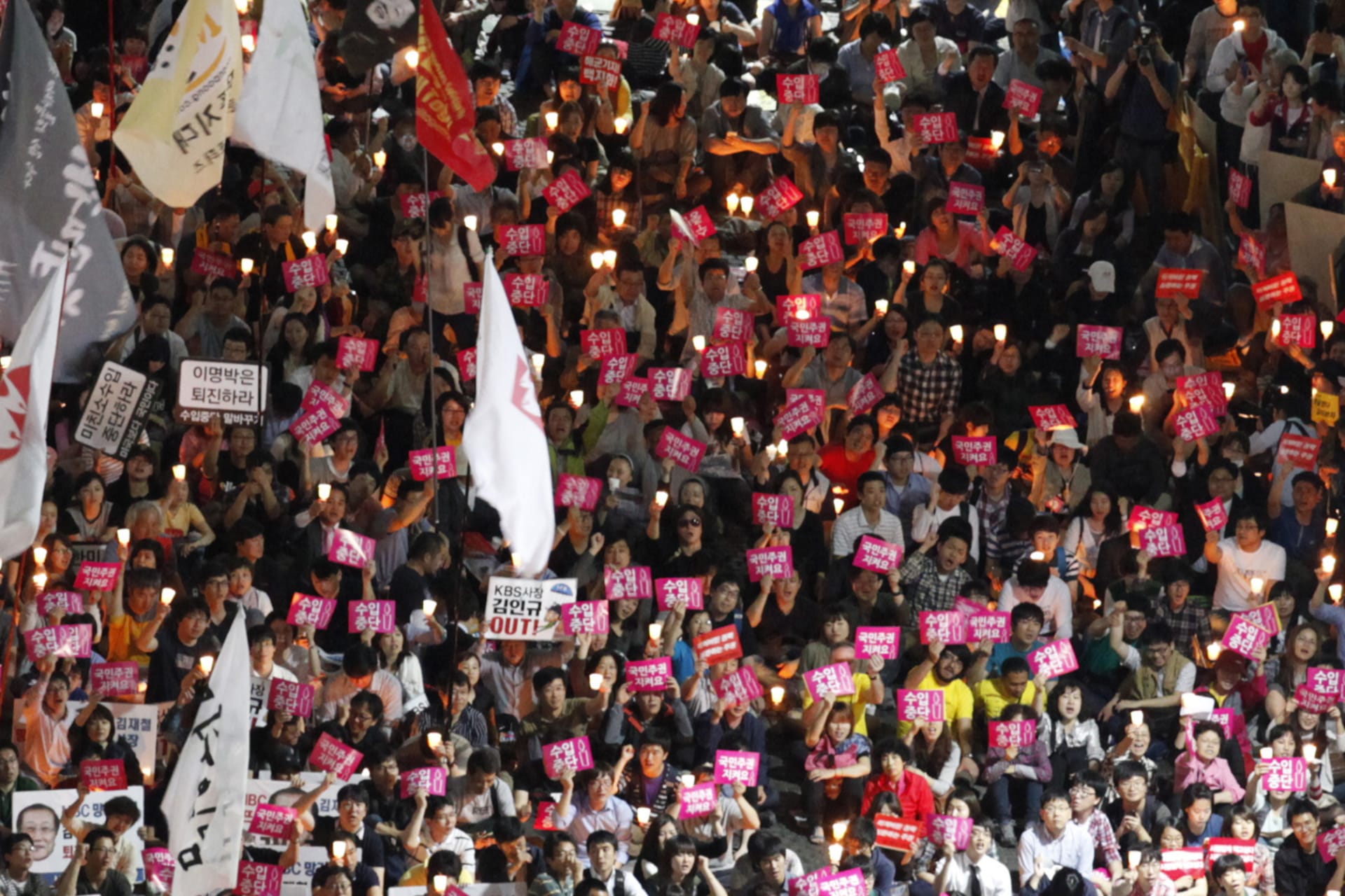 <p>South Koreans attend a candle-lit rally demanding a full ban on import of U.S. beef in Seoul on May 2, 2012.</p>
