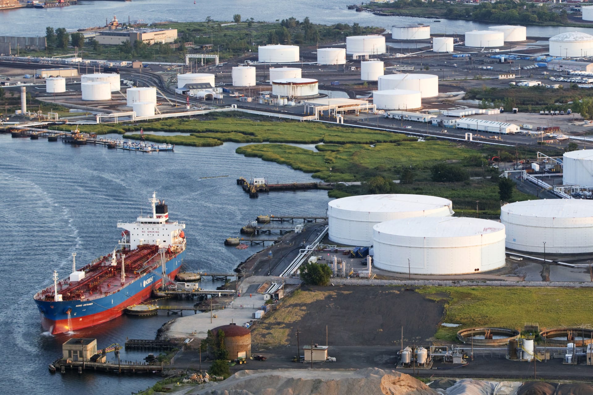<p>An oil tanker stands attached to a mooring station near a refinery in Bayonne, New Jersey, on August 24, 2011.</p>