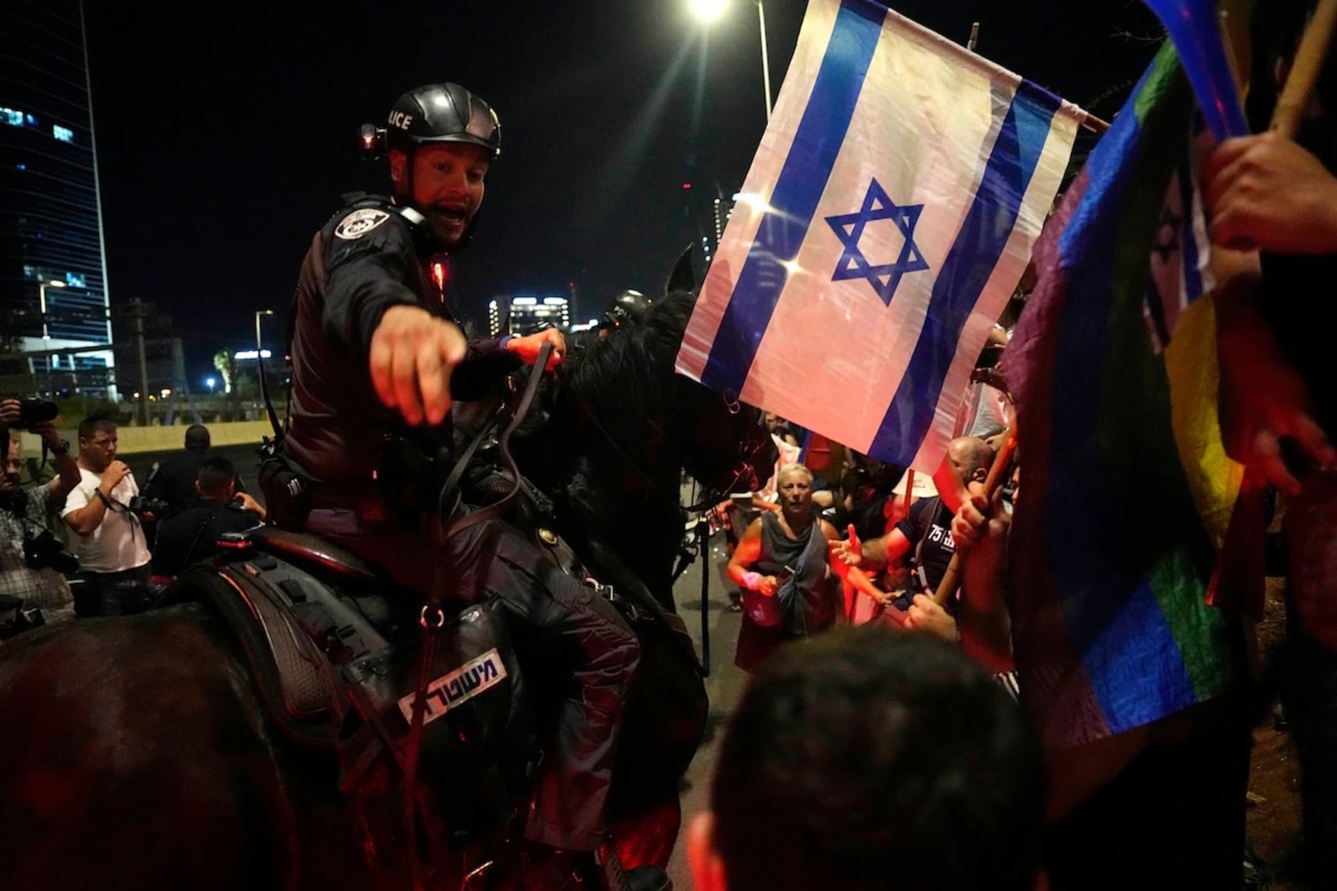 <p>Mounted police disperse Israelis protesting plans by Prime Minister Benjamin Netanyahu’s government to overhaul the judicial system from the Ayalon Highway in Tel Aviv on Thursday. </p>

