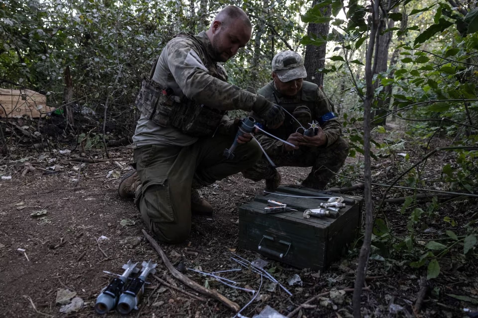 <p>Ukrainian soldiers in the 68th Jaeger Brigade prepare an FPV drone at dawn on Sept. 1 in the Luhansk region of Ukraine. The drone was intended to attack a nearby Russian military position.</p>
