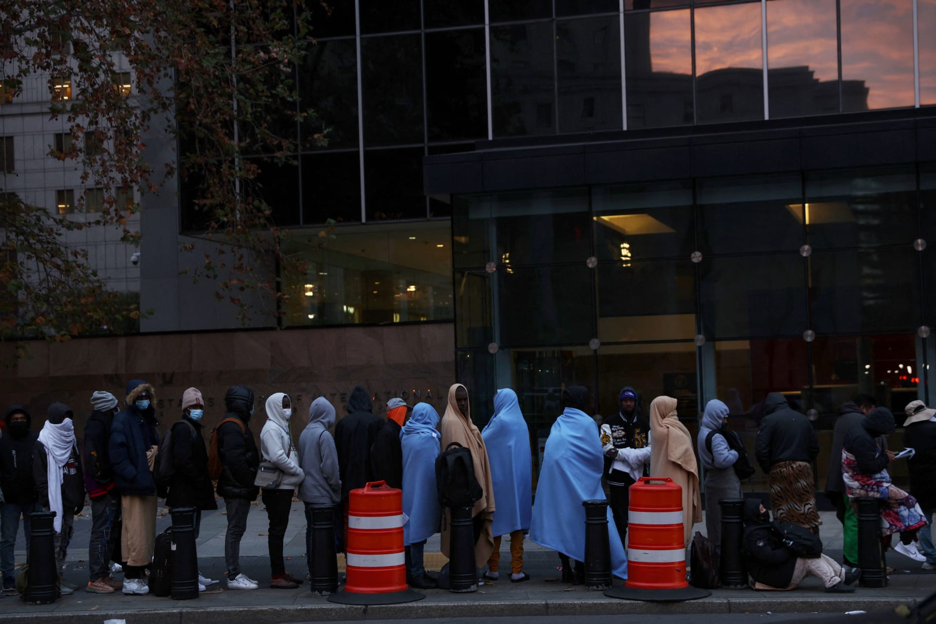 2023.11.21 Immigrants stand waiting in line outside the Federal Plaza Immigration Court in New York City