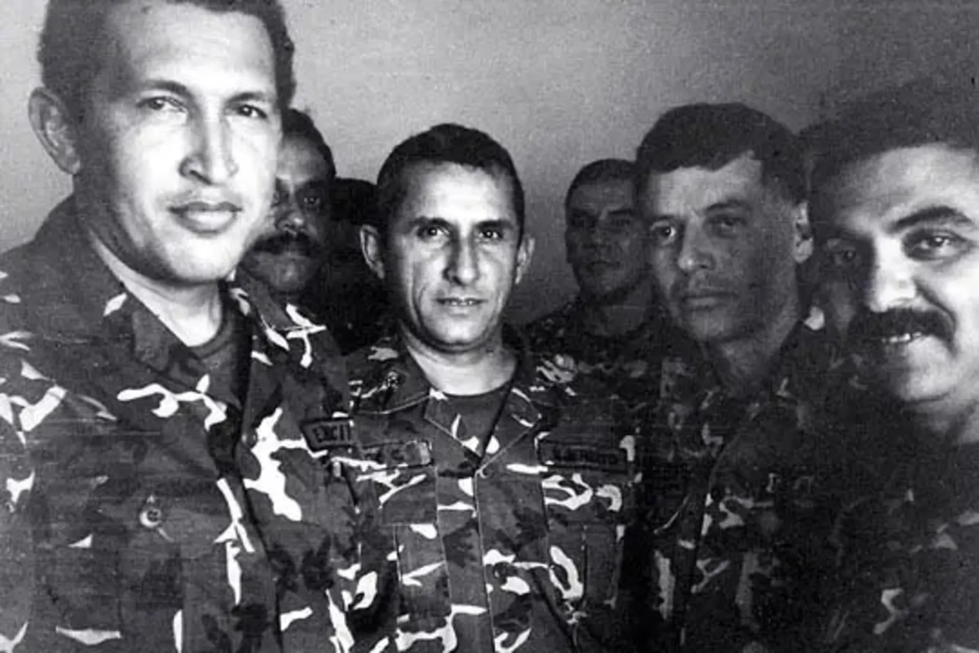 Chavez (left) and others in prison.
