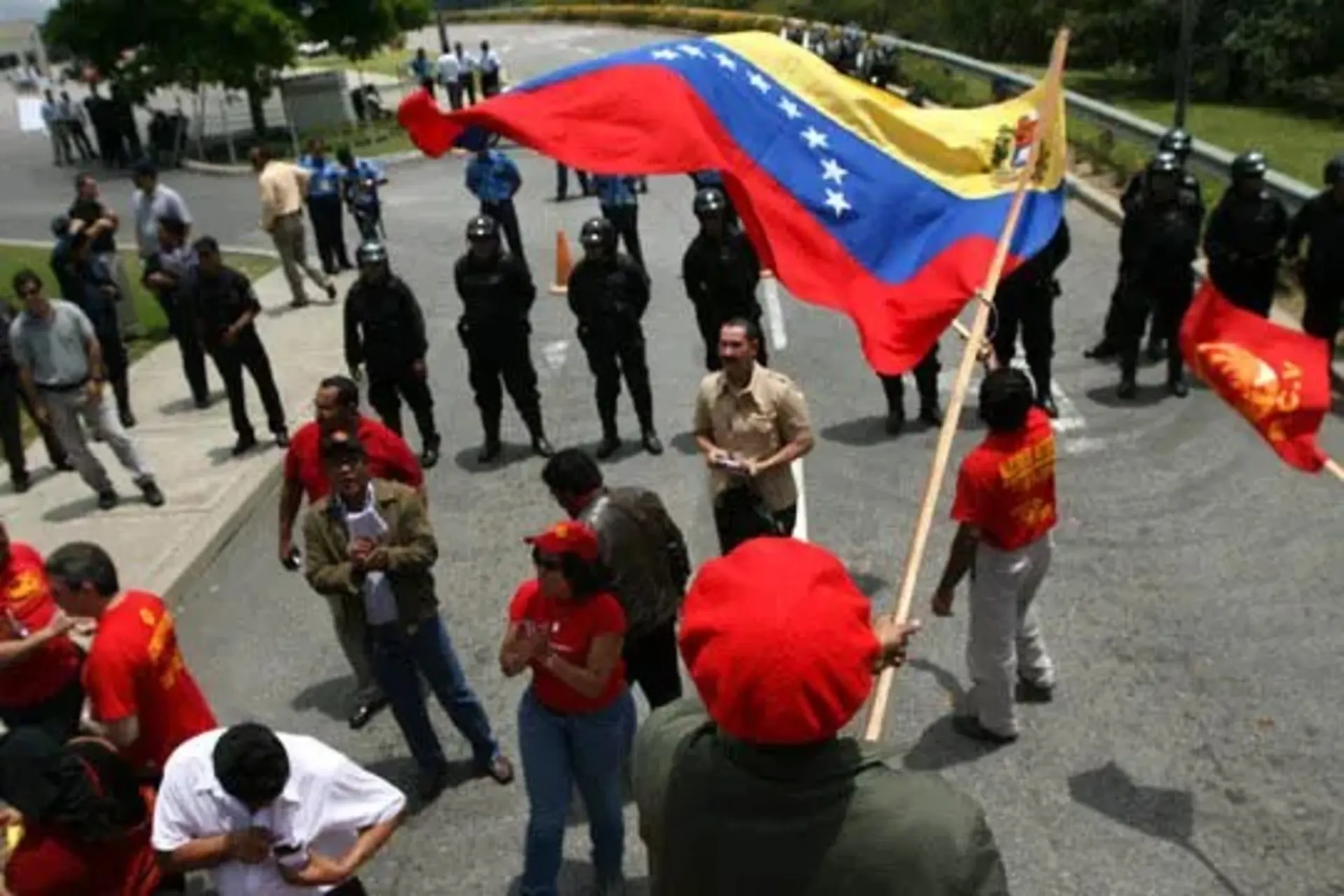 Members of the Venezuelan Communist Party and Chavez supporters rally outside the U.S. embassy in Caracas.
