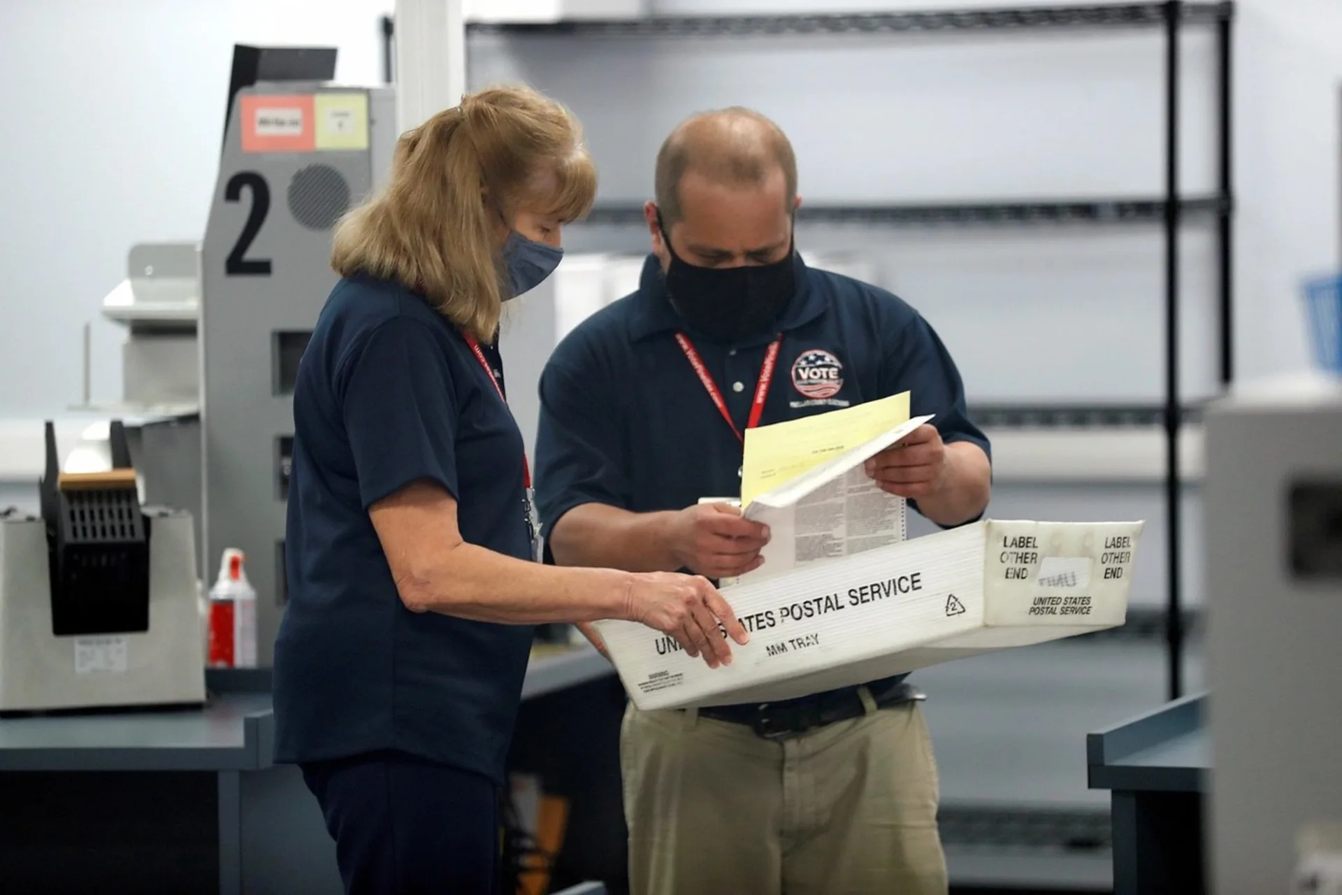 Members of the Pinellas County canvassing board process ballots on Election Day.