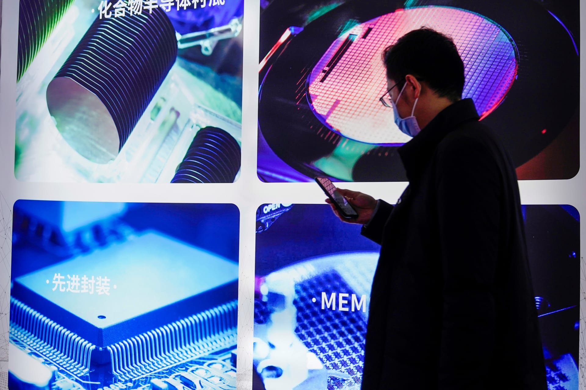<p>A man visits a display of semiconductor devices at Semicon China, a trade fair for semiconductor technology, in Shanghai, March 17, 2021.</p>
