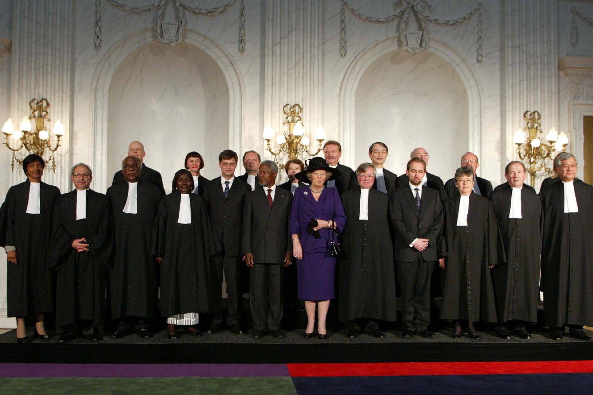 ICC judges pose with foreign dignitaries after the court’s inaugural ceremony. 