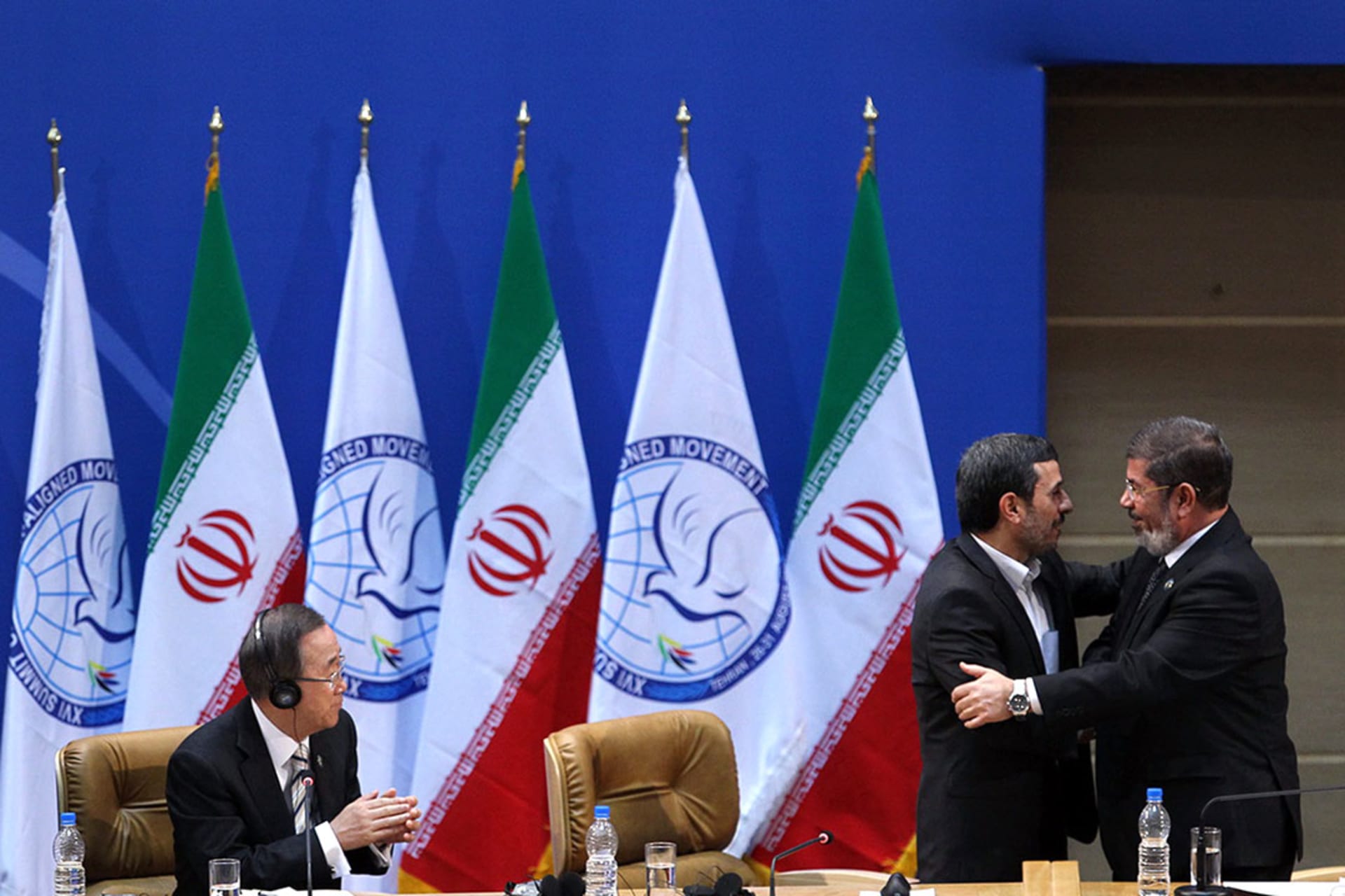 Iranian President Mahmoud Ahmadinejad talks to Egypt’s president, Mohammed Morsi, during the sixteenth summit of the Nonaligned Movement in Tehran. 
