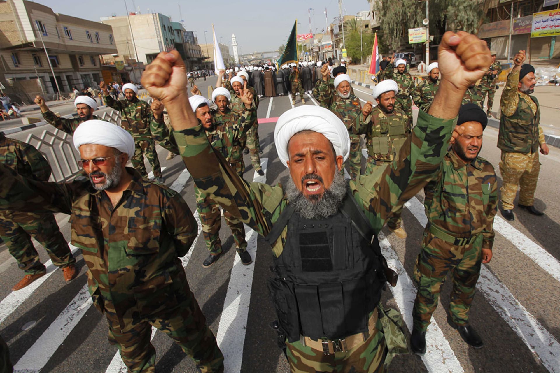 Mahdi Army fighters loyal to Shia cleric Muqtada al-Sadr march in Najaf. 