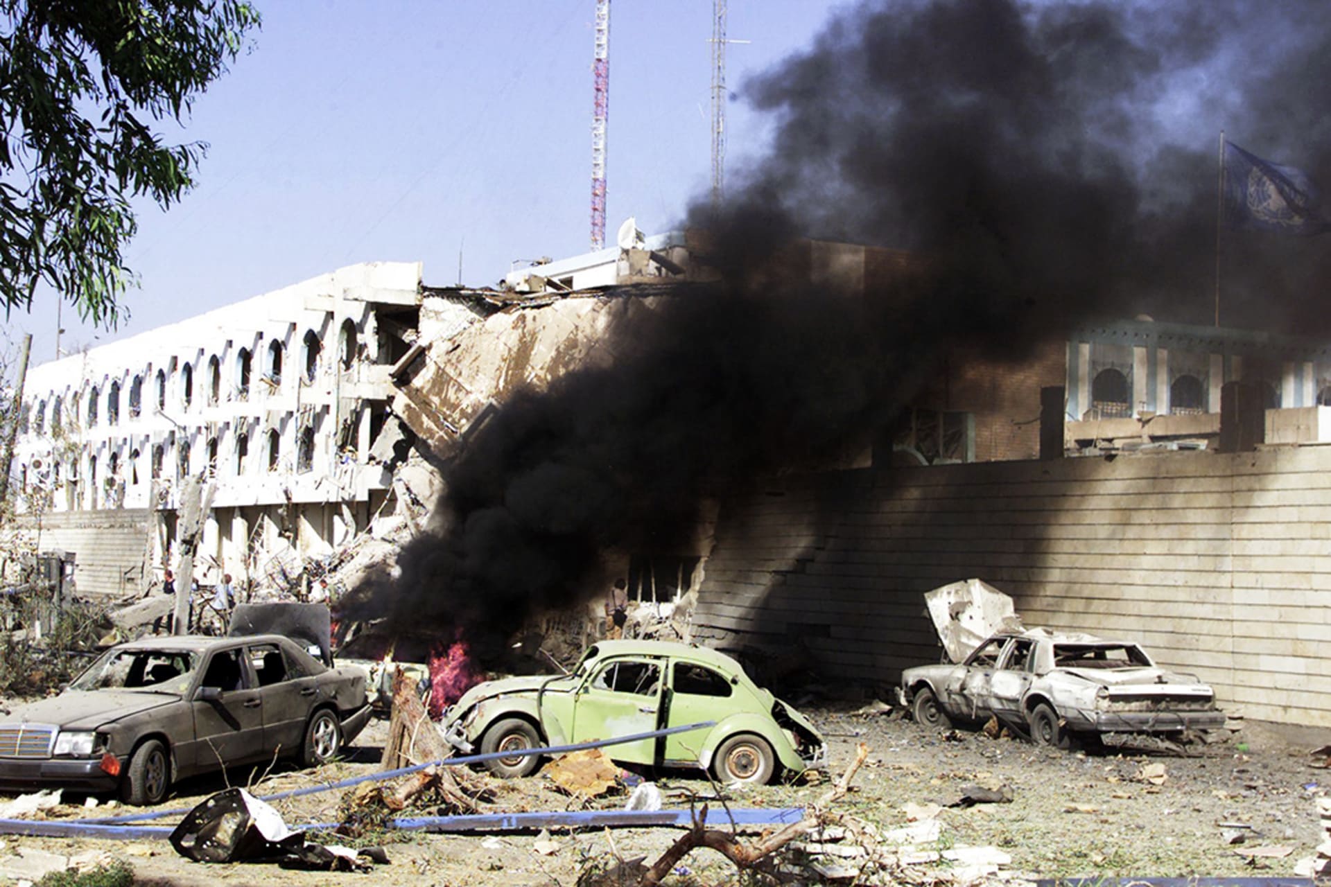 A car burns outside the UN headquarters at the Canal Hotel in eastern Baghdad after a truck bomb attack, August 19, 2003. Sabah Arar/AFP/Getty Images