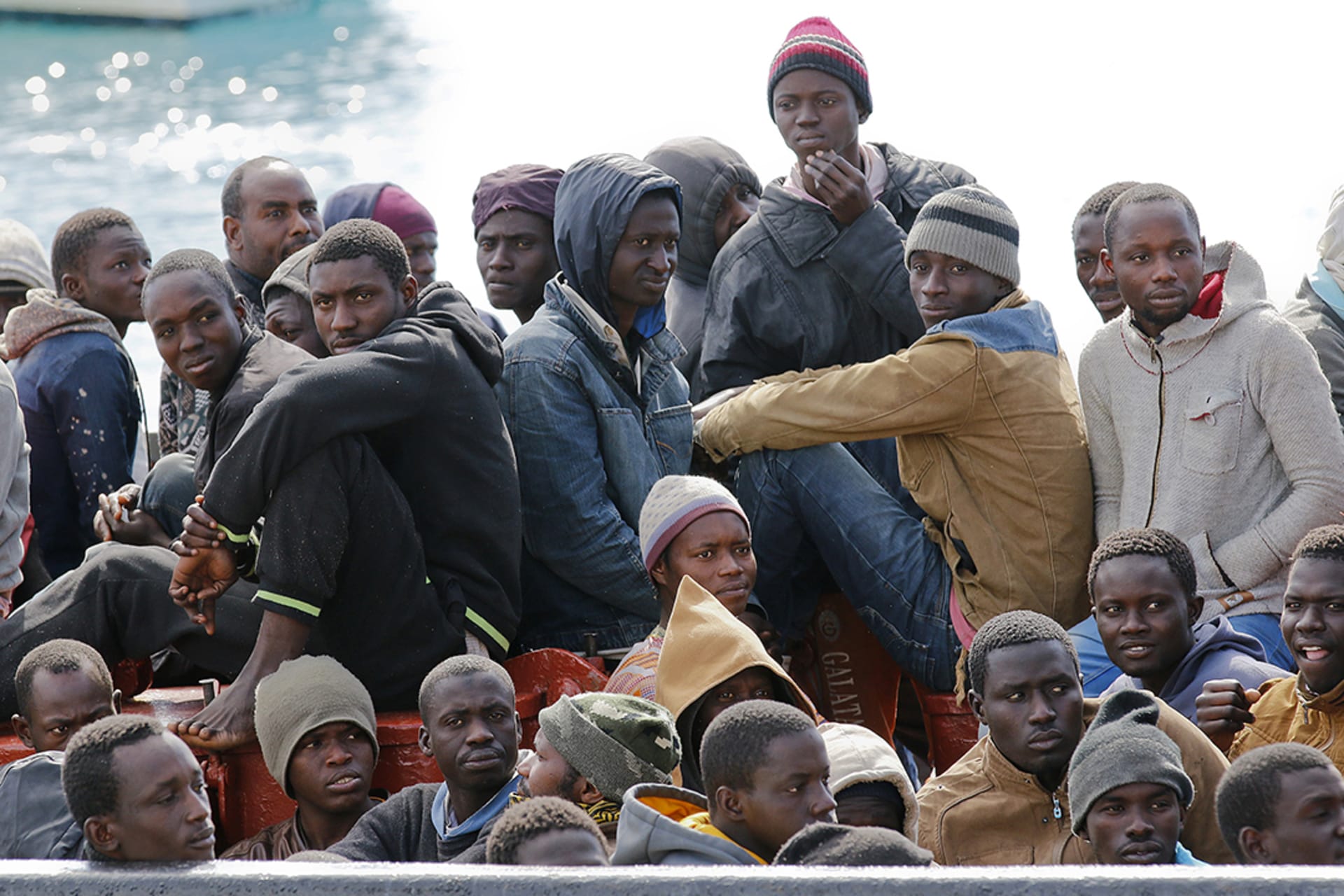 Migrants arrive at the Sicilian harbor of Pozzallo, Italy, after crossing the Mediterranean Sea from Libya, February 15, 2015. Antonio Parrinello/Reuters