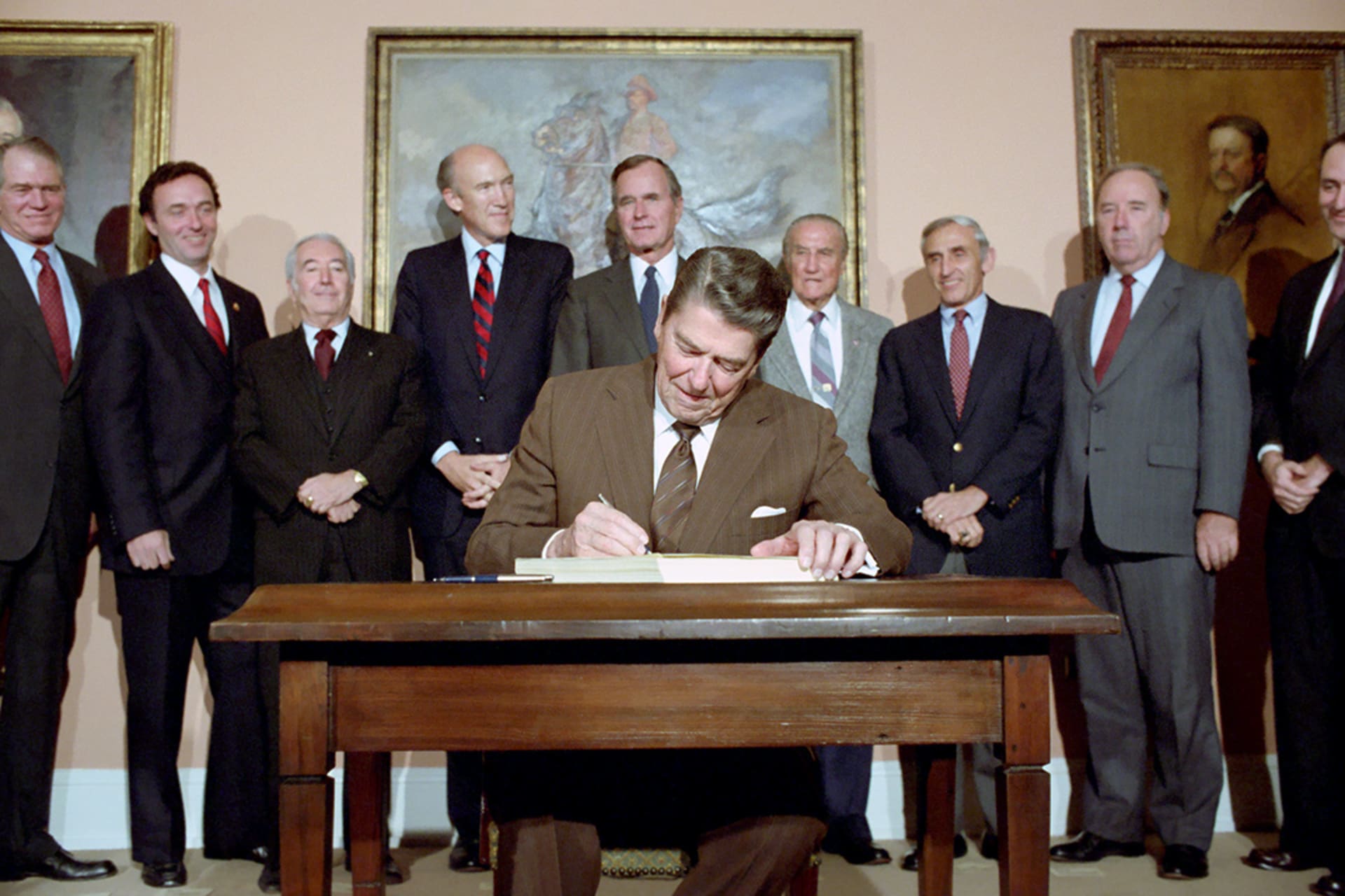 President Ronald Reagan signs the Immigration Reform and Control Act. National Archives