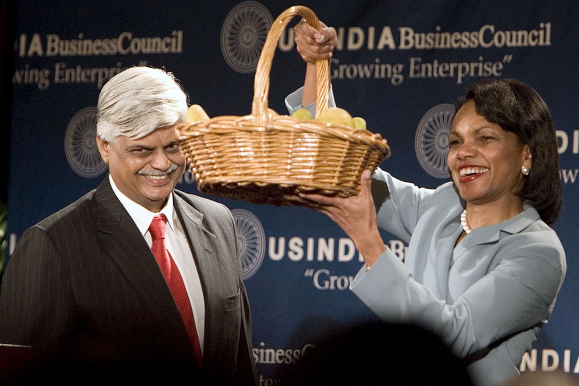 Secretary Rice holds a basket of mangoes given to her by an Indian official in June 2007. Joshua Roberts/Reuters
