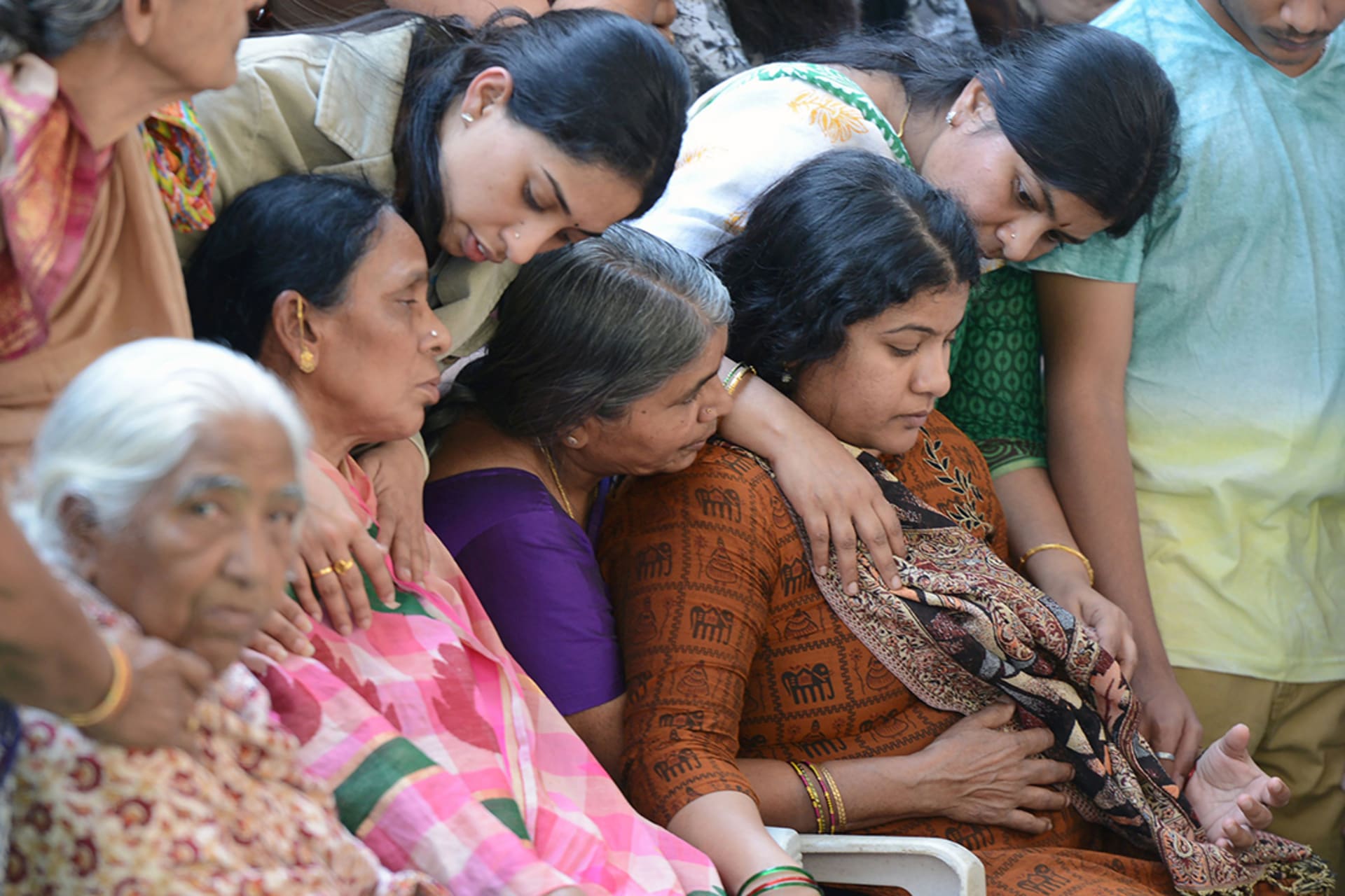 The wife of Srinivas Kuchibhotla, who was shot dead in Kansas, is consoled by family members. Noah Seelam/AFP/Getty Images