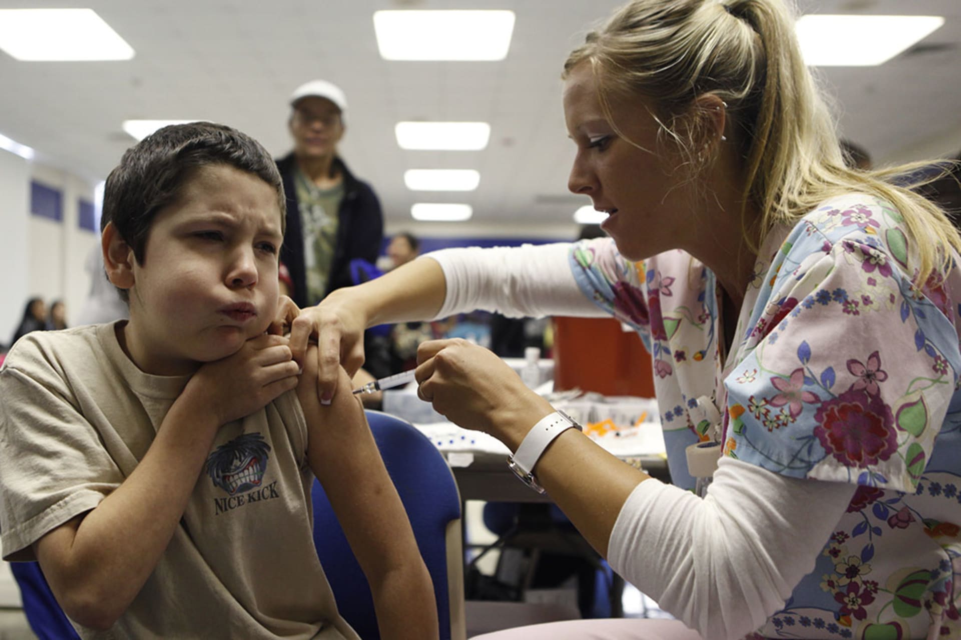 A nurse administers the H1N1 vaccine to ten-year-old Anthony Adams in Haltom City, Texas, in October 2009. Jessica Rinaldi/Reuters