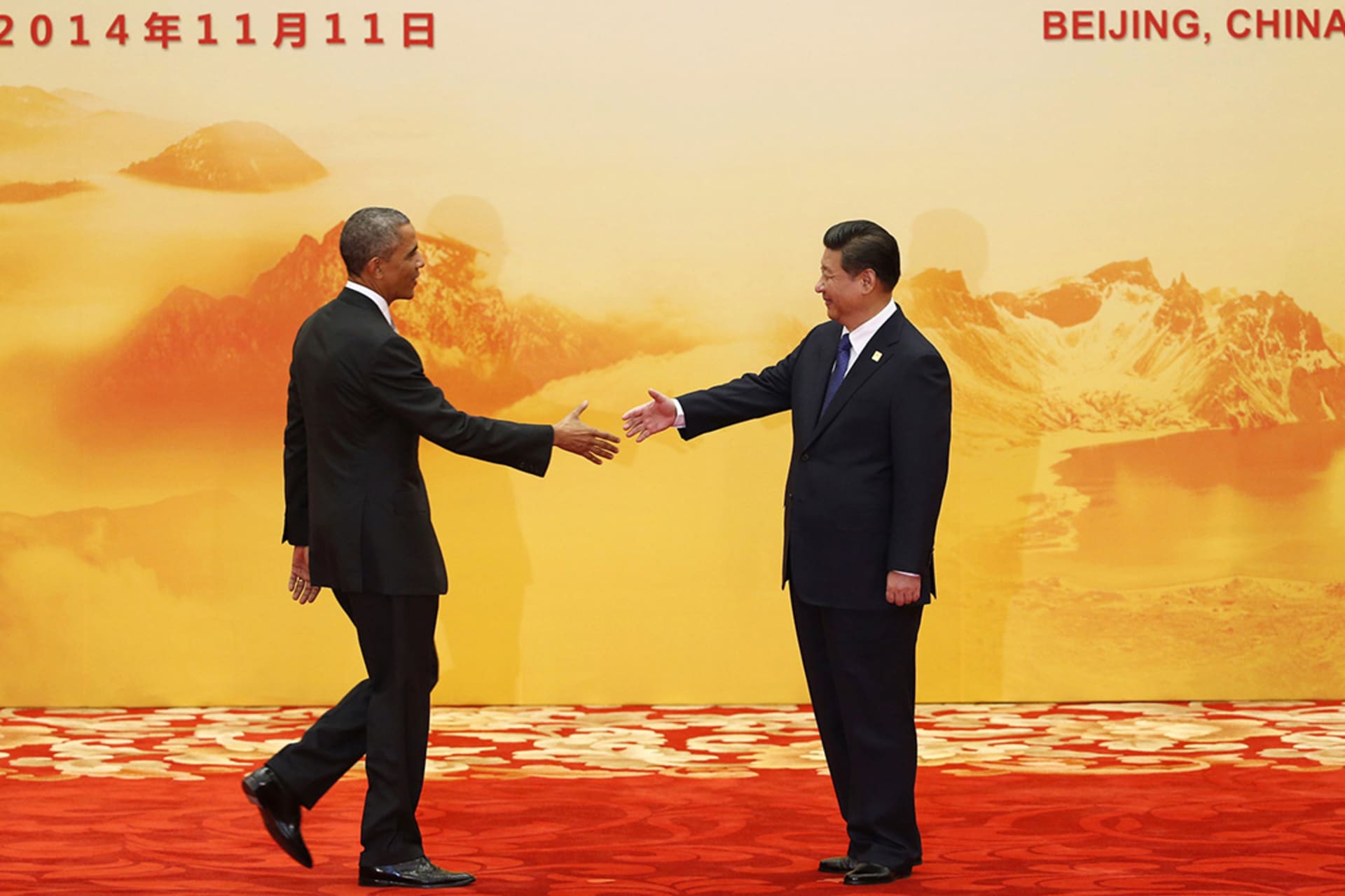 Obama and Xi shake hands during an Asia-Pacific Economic Cooperation (APEC) summit in Beijing. 
