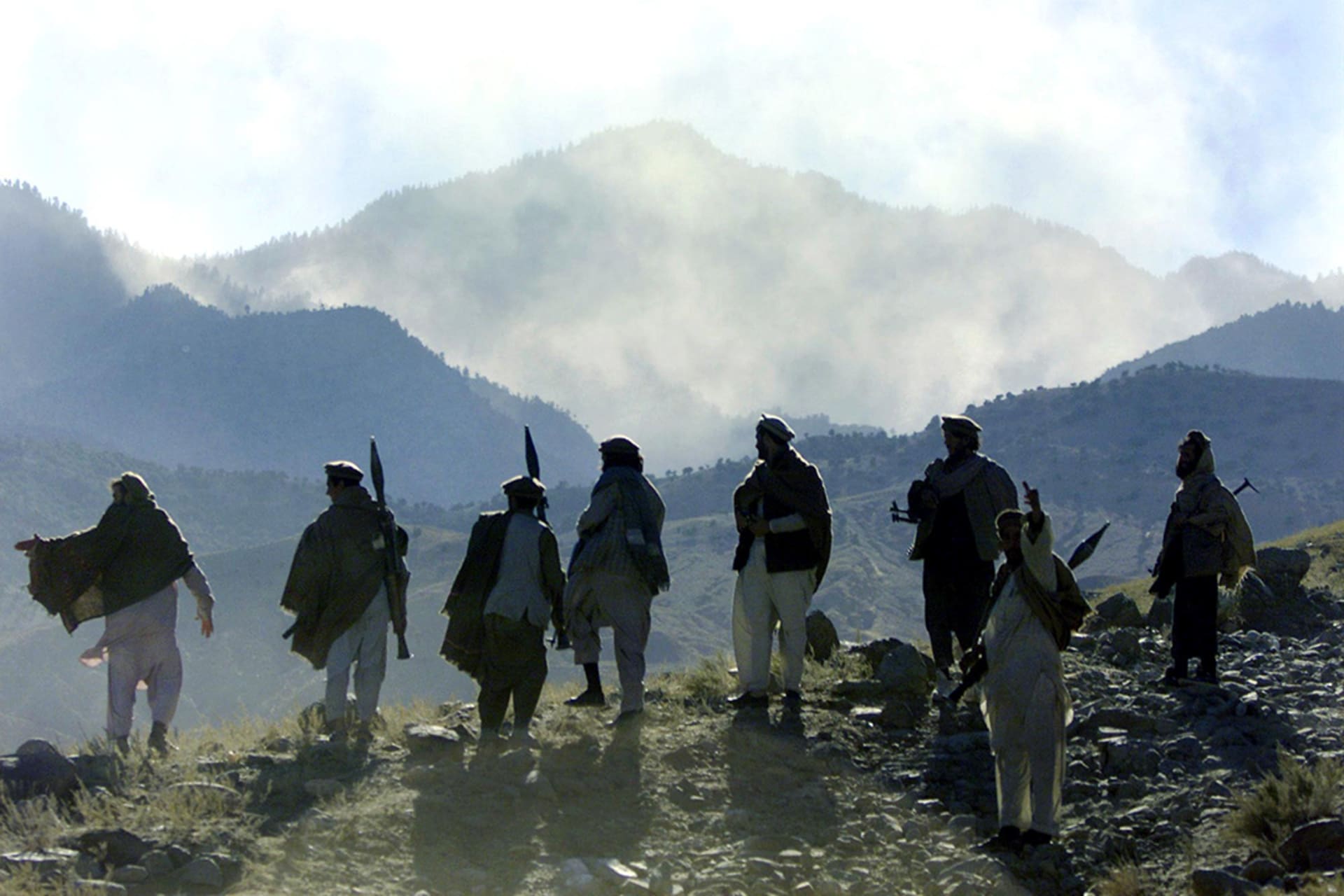 Mujahadeen fighters in the mountains of Tora Bora, Afghanistan, December 2001. 
