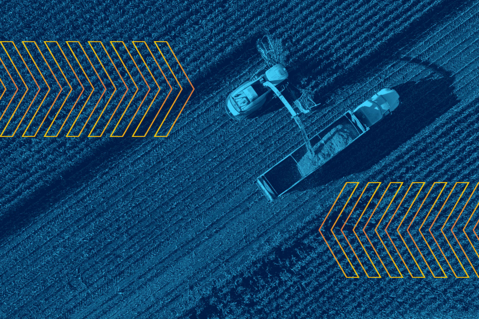 <p>Aerial view of tractors harvesting crop.</p>
