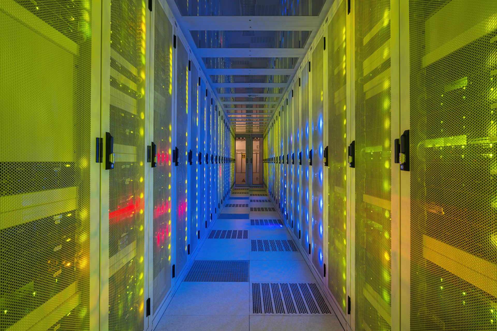 <p>Multi colored server room of data center.</p>