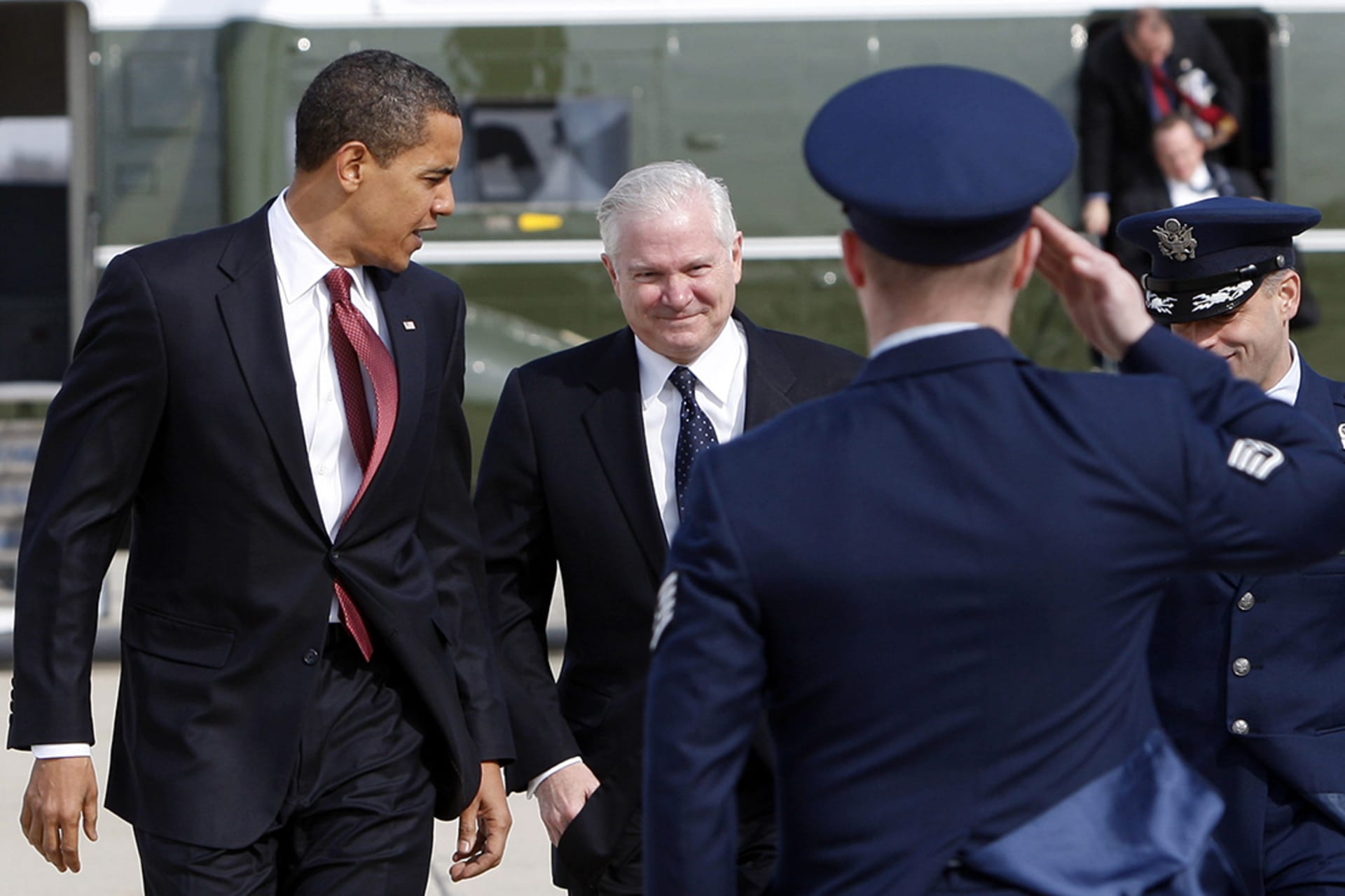 Obama and Defense Secretary Gates prepare to board Air Force One at Andrews Air Force Base in February 2009. 
