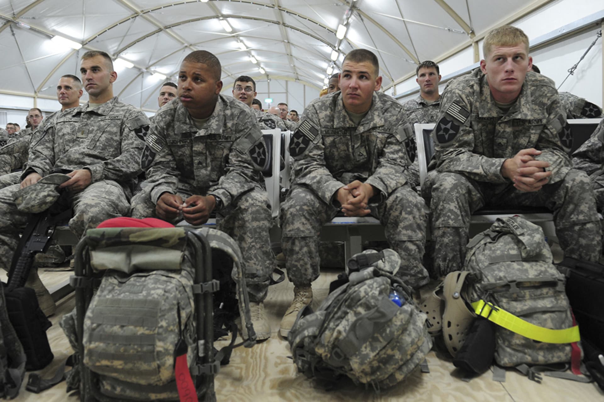U.S. soldiers await their flight back to the United States at Camp Virginia in Kuwait. 
