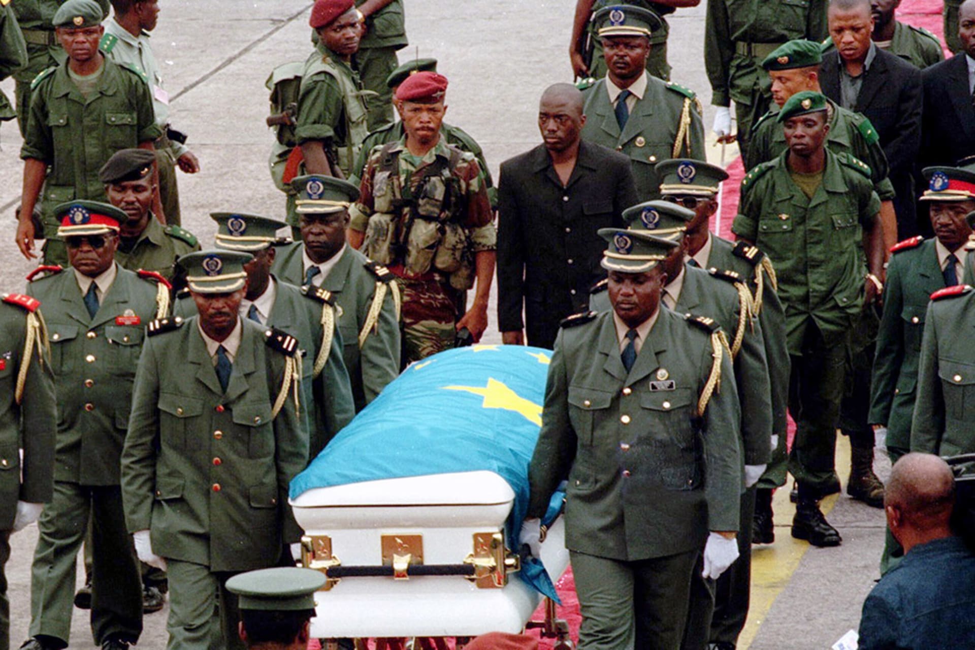 Joseph Kabila Kabange follows the coffin of his father as it is transported by military officers, on January 21, 2001. Desirey Minkoh/AFP/Getty Images