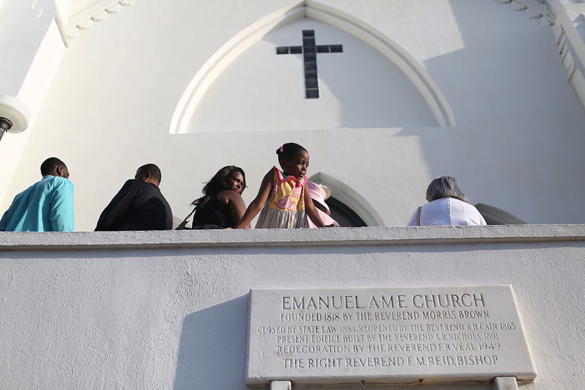 People line up to attend Sunday services following a mass shooting at Emanuel African Methodist Episcopal Church in Charleston, South Carolina. 
