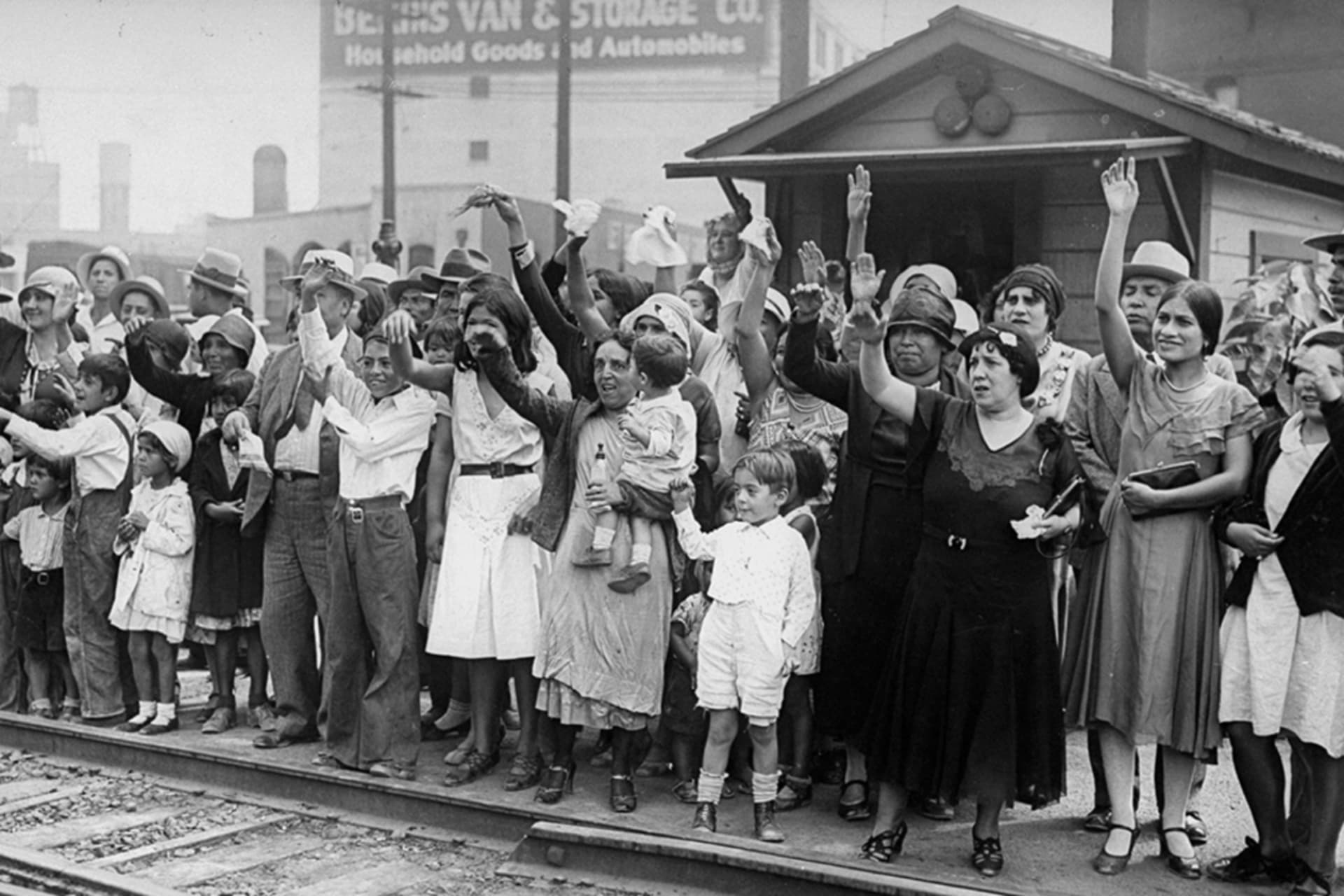 Friends and family wave goodbye to Mexicans who are being expelled back to Mexico as the United States begins a national repatriation program. New York Daily News Archive/Getty Images
