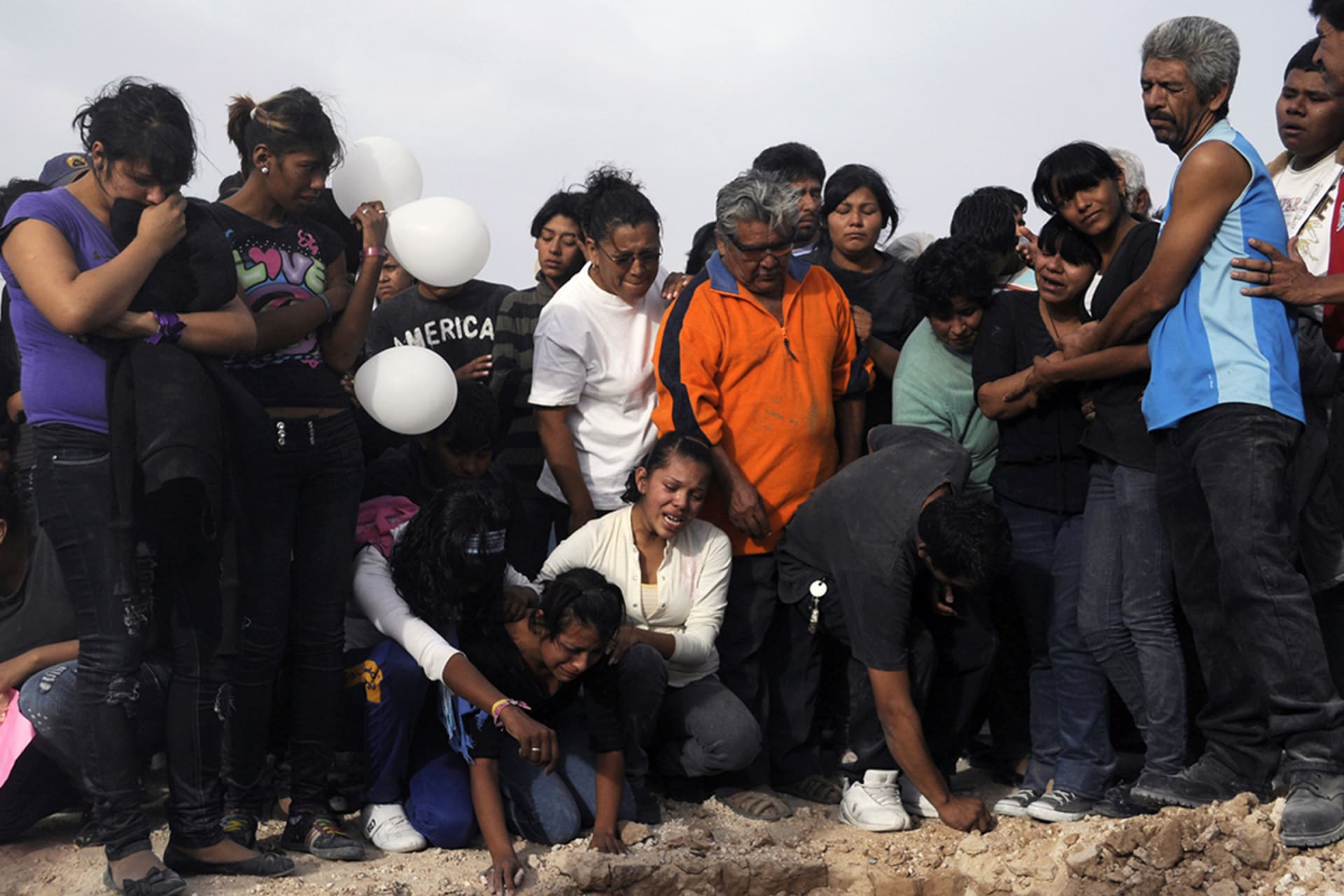 Family and friends mourn the victims of those killed at a birthday party in Ciudad Juárez in October 2010. Gael Gonzalez/Reuters