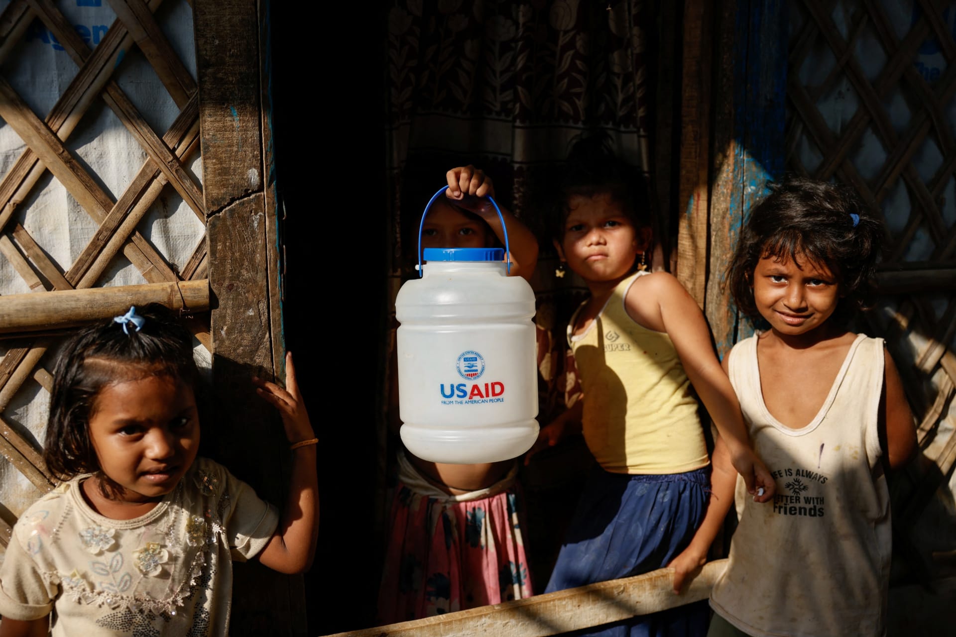 <p>A Rohingya refugee girl holds a jar with USAID logo imprinted at the refugee camp in Cox’s Bazar, Bangladesh on March 16, 2025.</p>