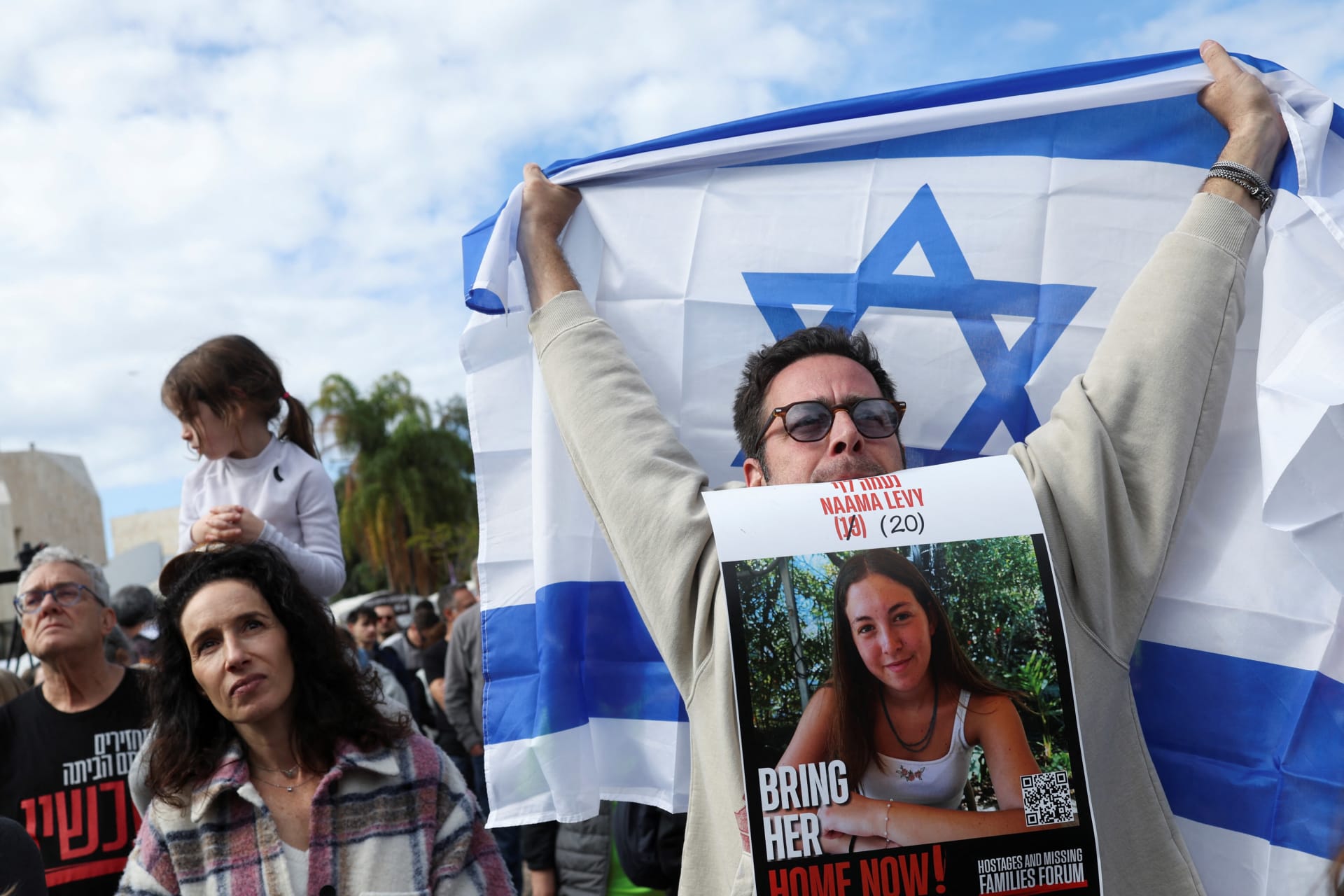 <p>A crowd in Tel Aviv watches a broadcast of the release of Israelis held hostage by Hamas on January 25, 2025.</p>
