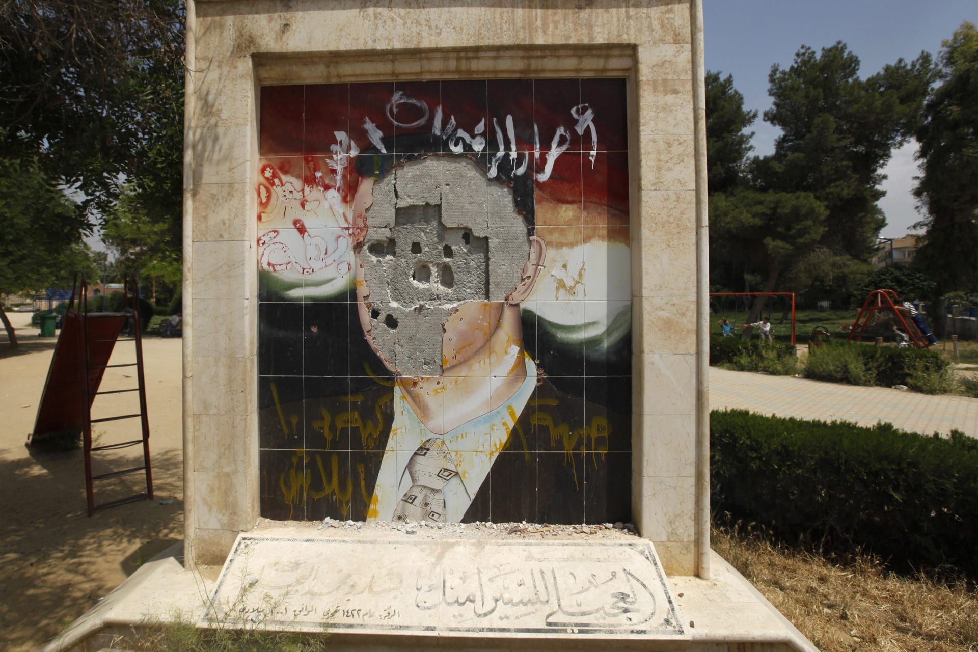 <p>A vandalised mosaic picture of Syria’s President Bashar al-Assad is pictured in Raqqa province, east Syria May 1, 2013. </p>