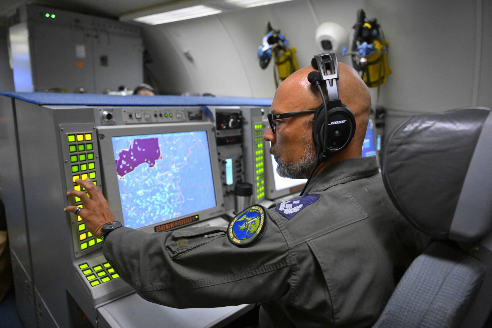 <p>A crew member looks at a map of Polish airspace near the Ukrainian border during a flight as part of NATO’s Eastern Sentry mission on September 19, 2025.</p>