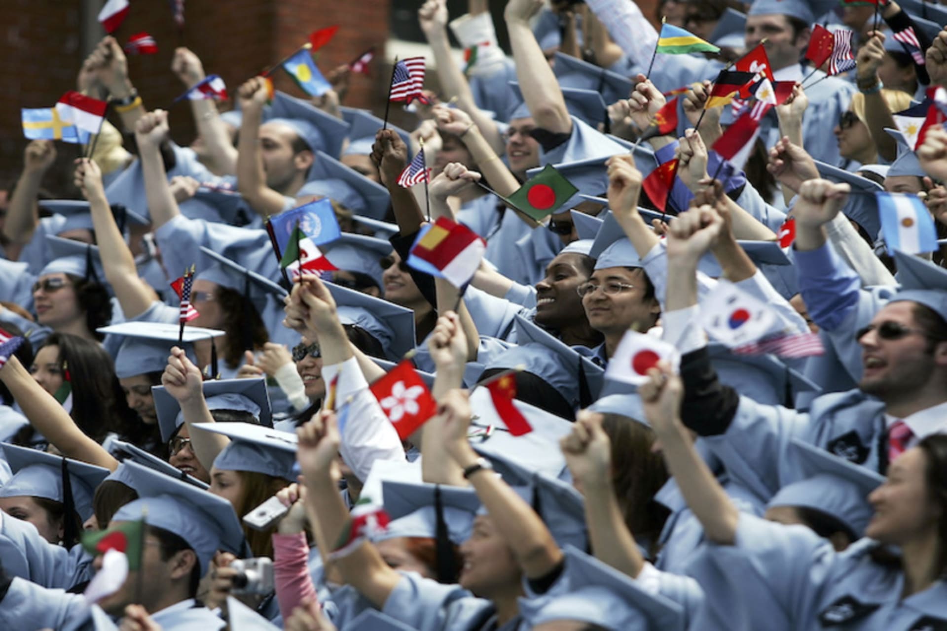 <p>Students cheer during commencement ceremonies at Columbia University May 18, 2005 in New York City. This is the 251st class to graduate from Columbia.</p>