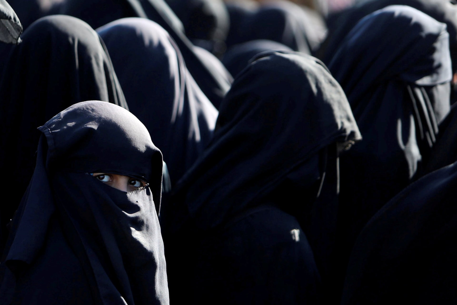 <p>Women stand together at al-Hol camp in Syria.</p>
