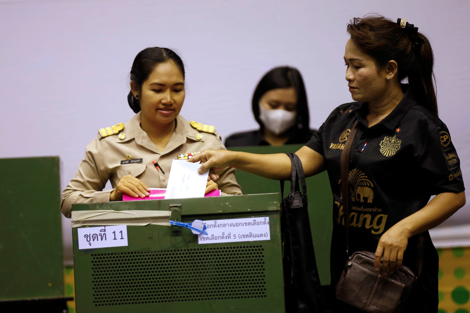 <p>A woman casts her early vote in Bangkok.</p>
