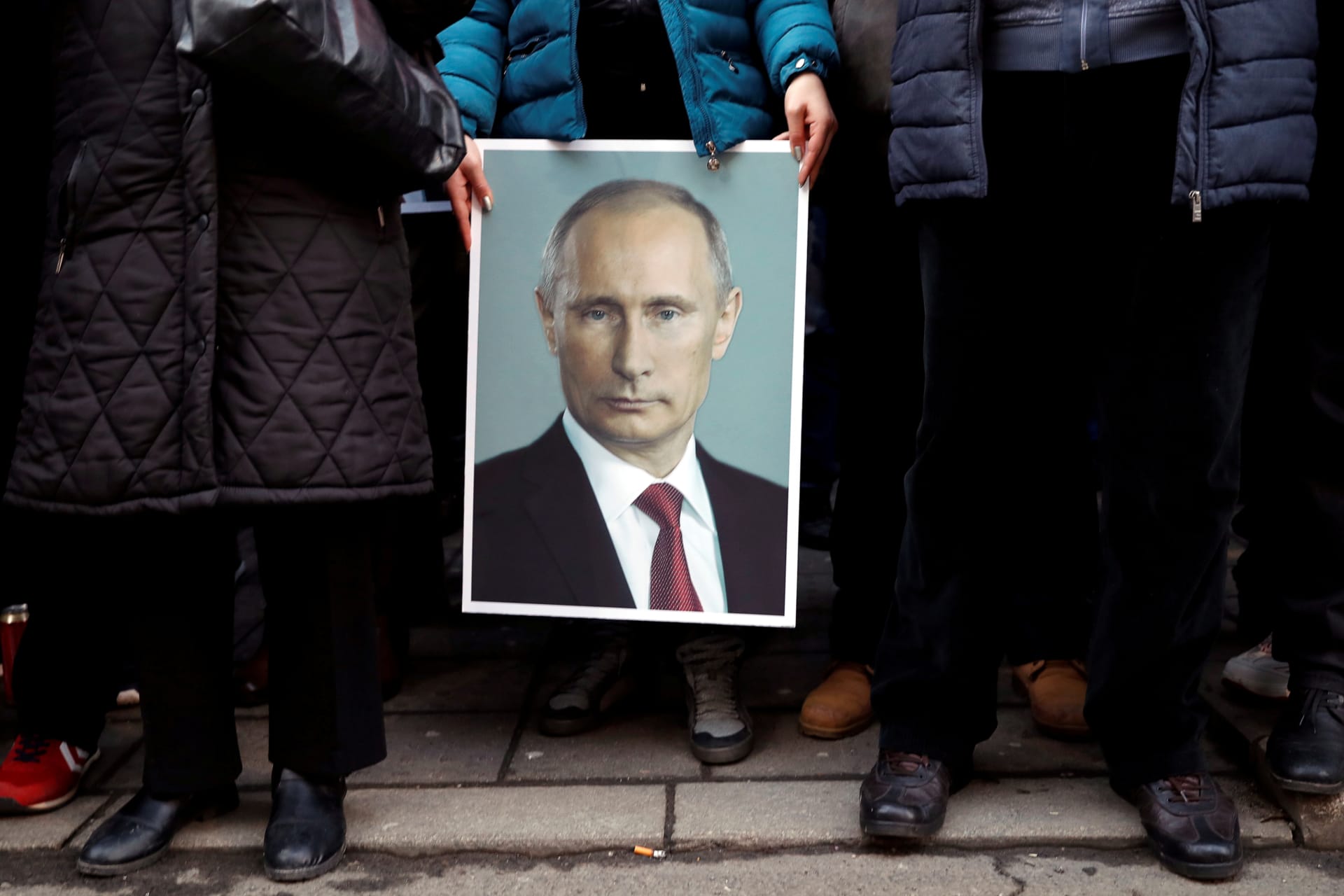 <p>A supporter of Russian President Vladimir Putin holds his portrait in Belgrade, Serbia, January 18, 2019.</p>
