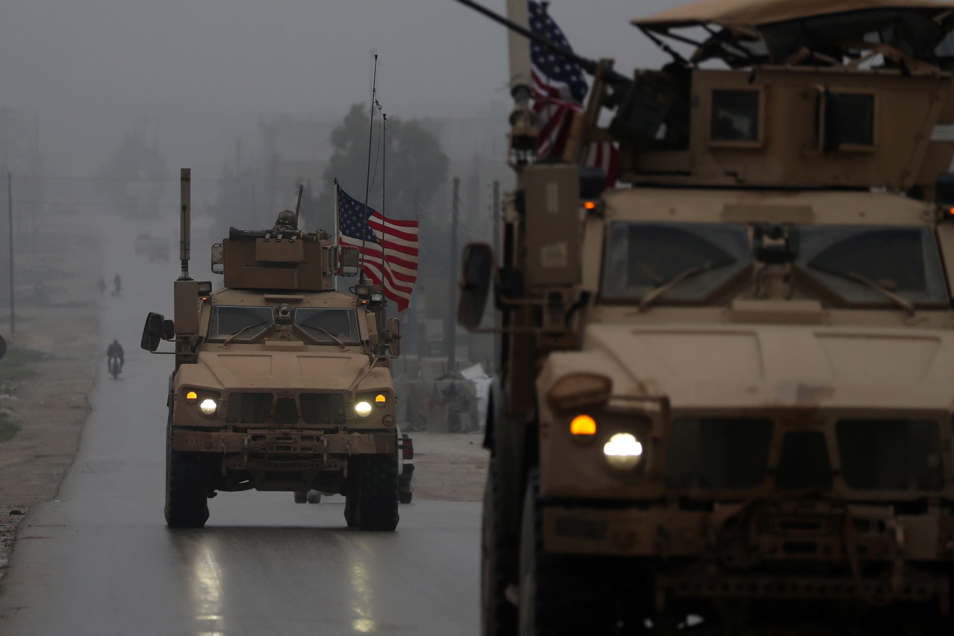 <p>U.S. military vehicles drive through northern Syrian city of Manbij, December 30, 2018.</p>
