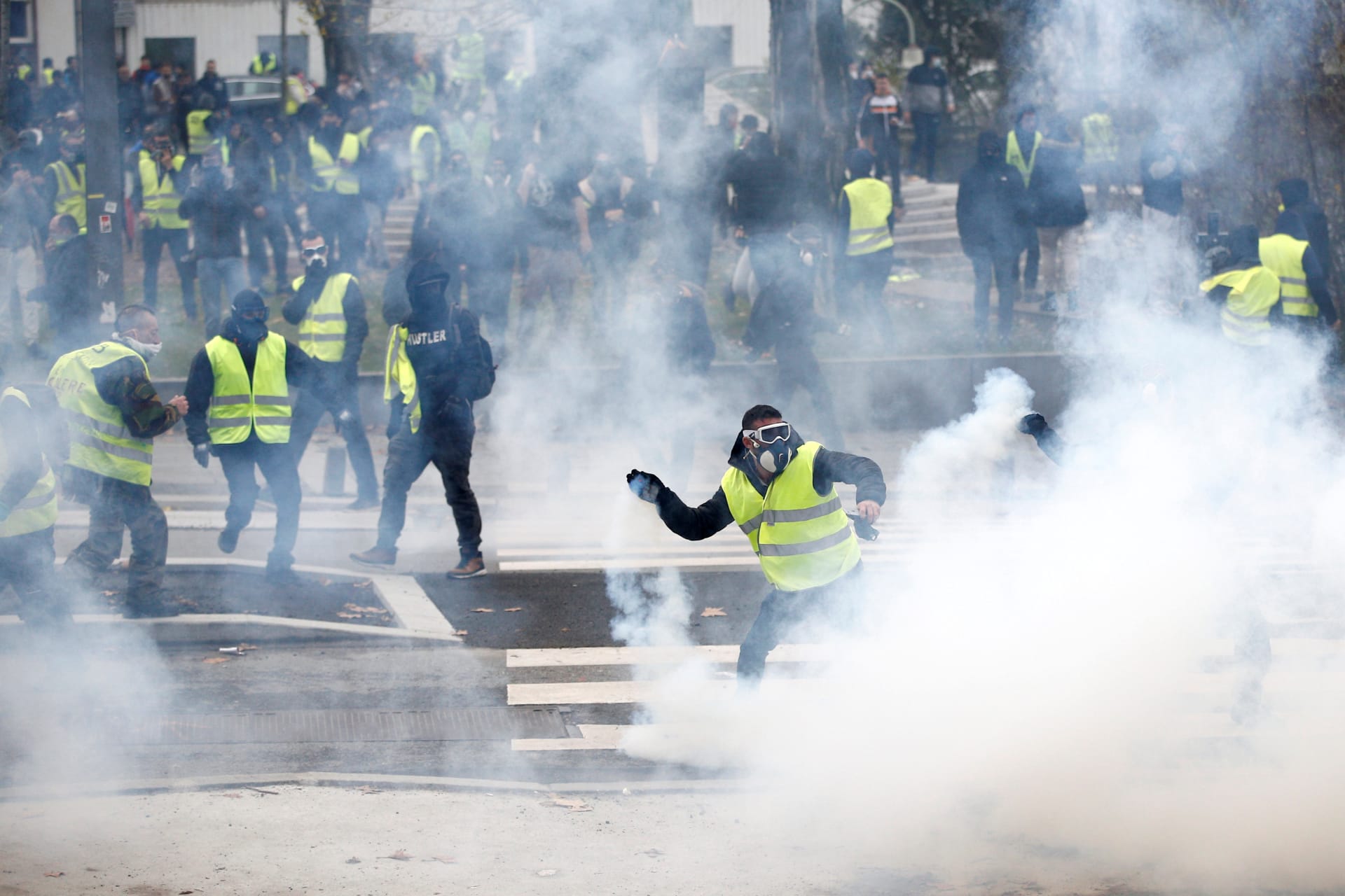 <p>Protesters wearing yellow vests clash with police during a demonstration of the “yellow vests” movement in Nantes, France, December 22, 2018.</p>
