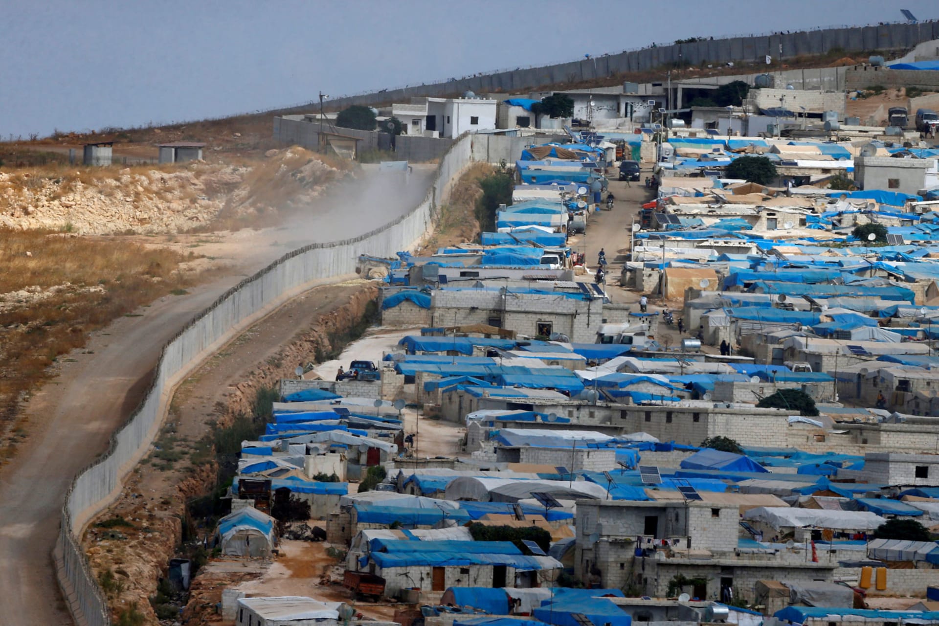 <p> A wall along the border between Turkey and Syria is pictured at the Syrian town of Atimah, Idlib province, in this picture taken from Reyhanli, Hatay province, Turkey, October 10, 2017.</p>
