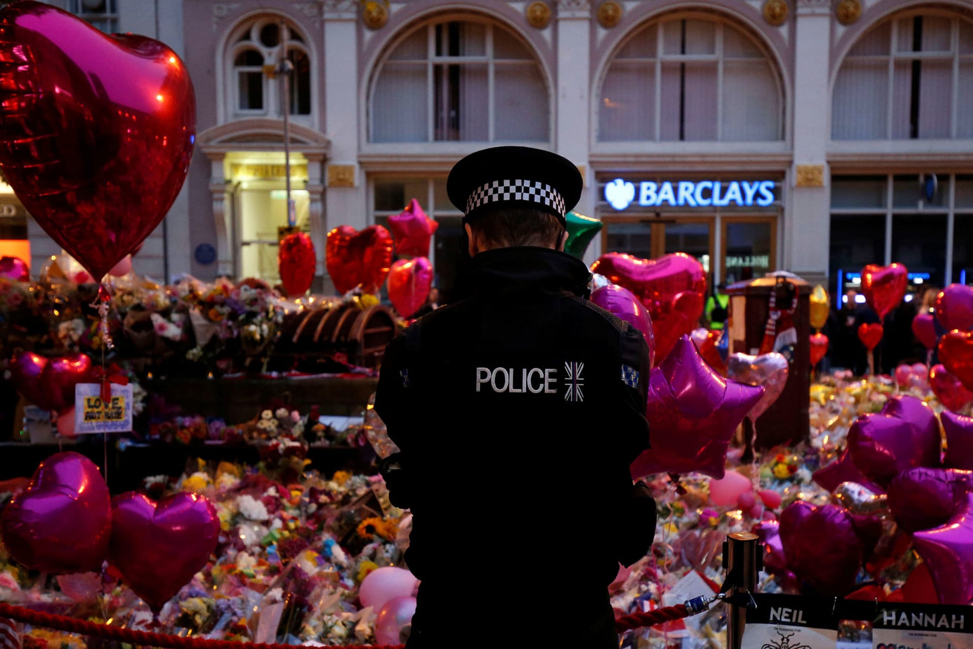 <p>A police officer stands at a vigil for the victims of the attack at a concert in Manchester.</p>