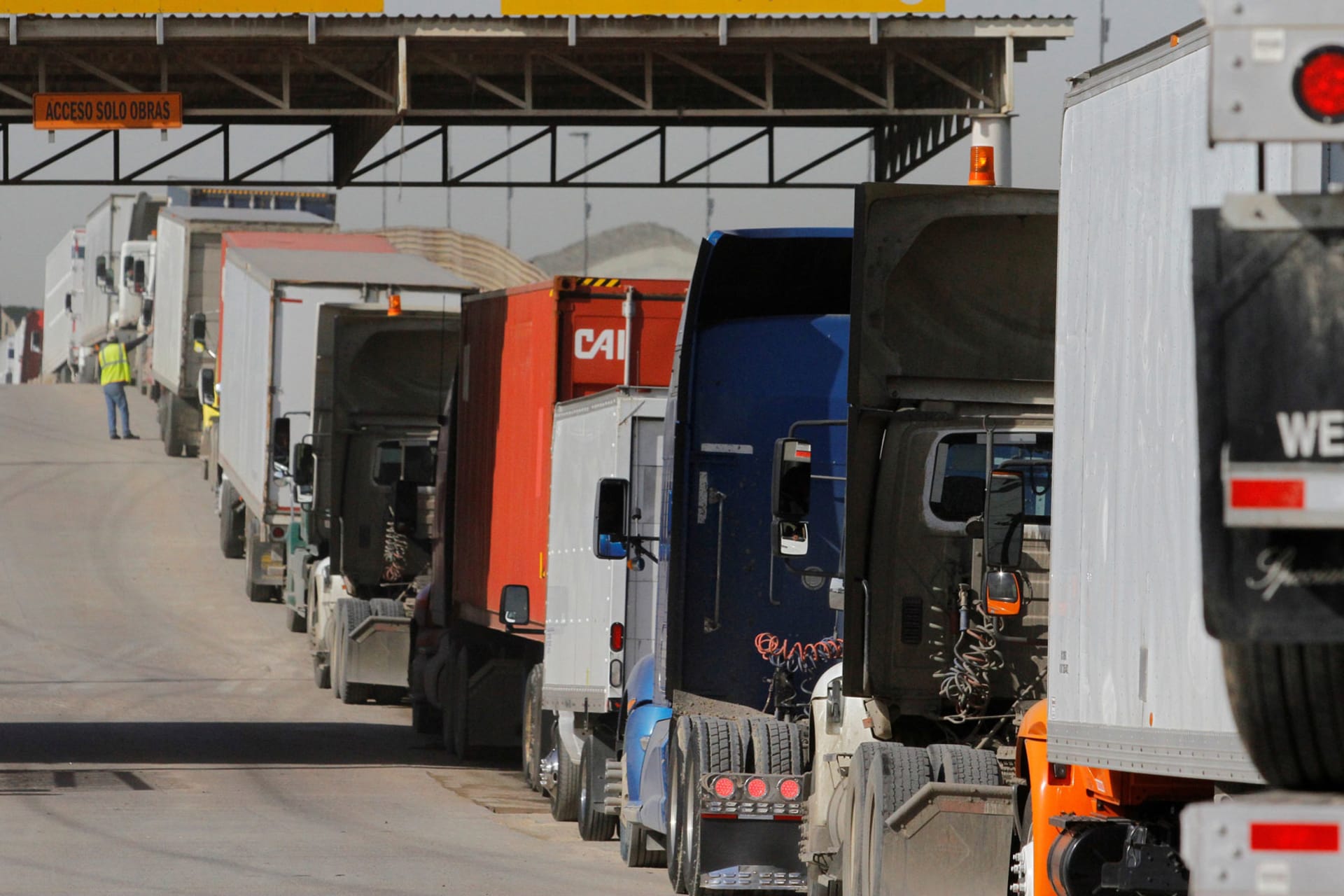 <p>Trucks wait to cross border customs control at the Otay border crossing in Tijuana, Mexico, February 2, 2017</p>
