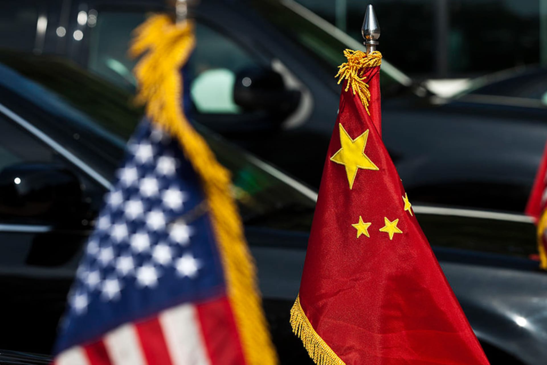 <p>U.S. and China national flags adorn the motorcade of U.S. Vice President Joe Biden during a diplomatic visit to Beijing, China in 2011.</p>
