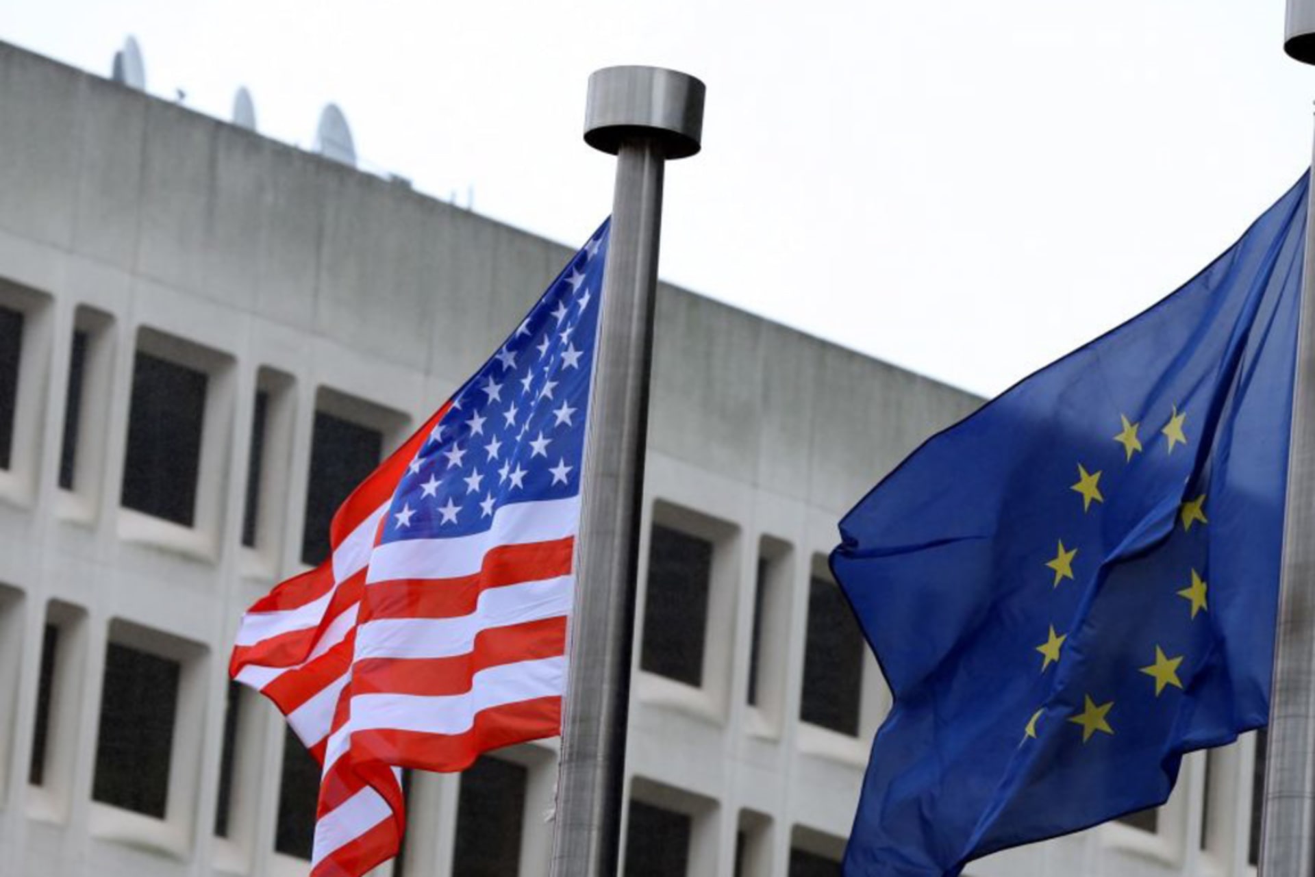 <p>The national flag of the United States flies with the European Union flag in Brussels, Belgium.</p>

