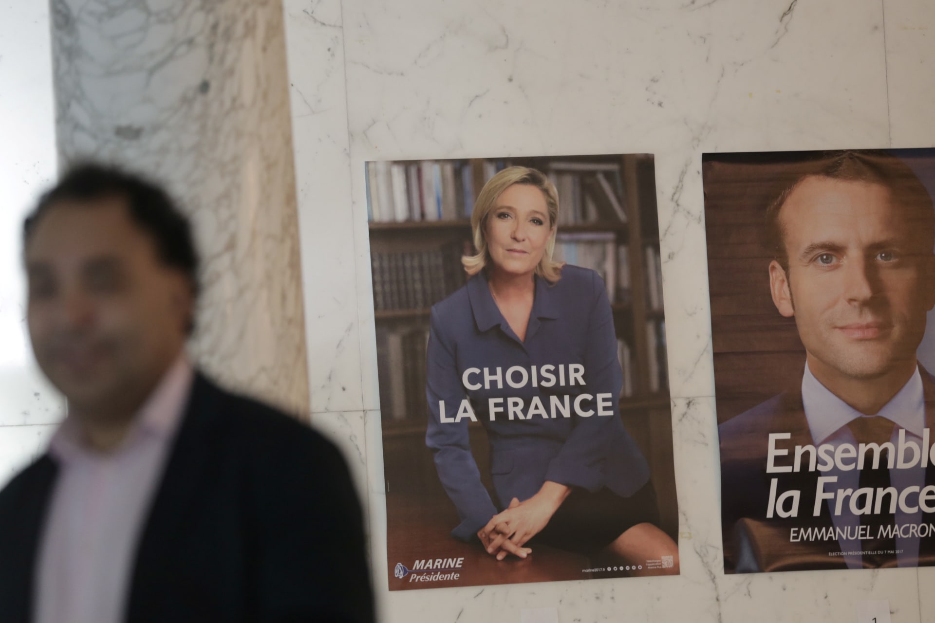 <p>Campaign posters on display for presidential candidates Marine Le Pen and Emmanuel Macron during the second round of the French presidential election.</p>
