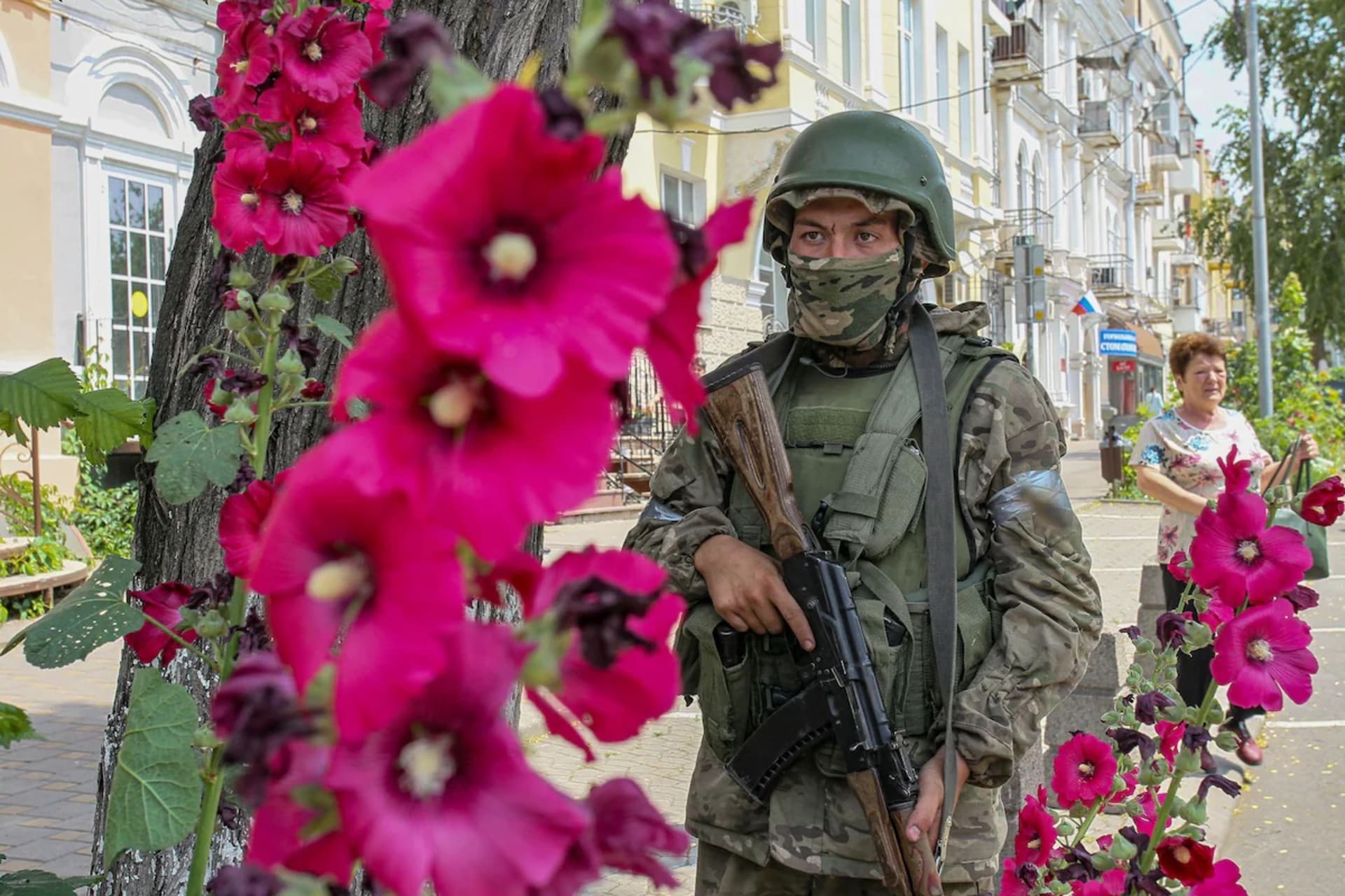 <p>A member of the Wagner mercenary group patrols a street in downtown Rostov-on-Don, Russia, on Saturday. </p>
